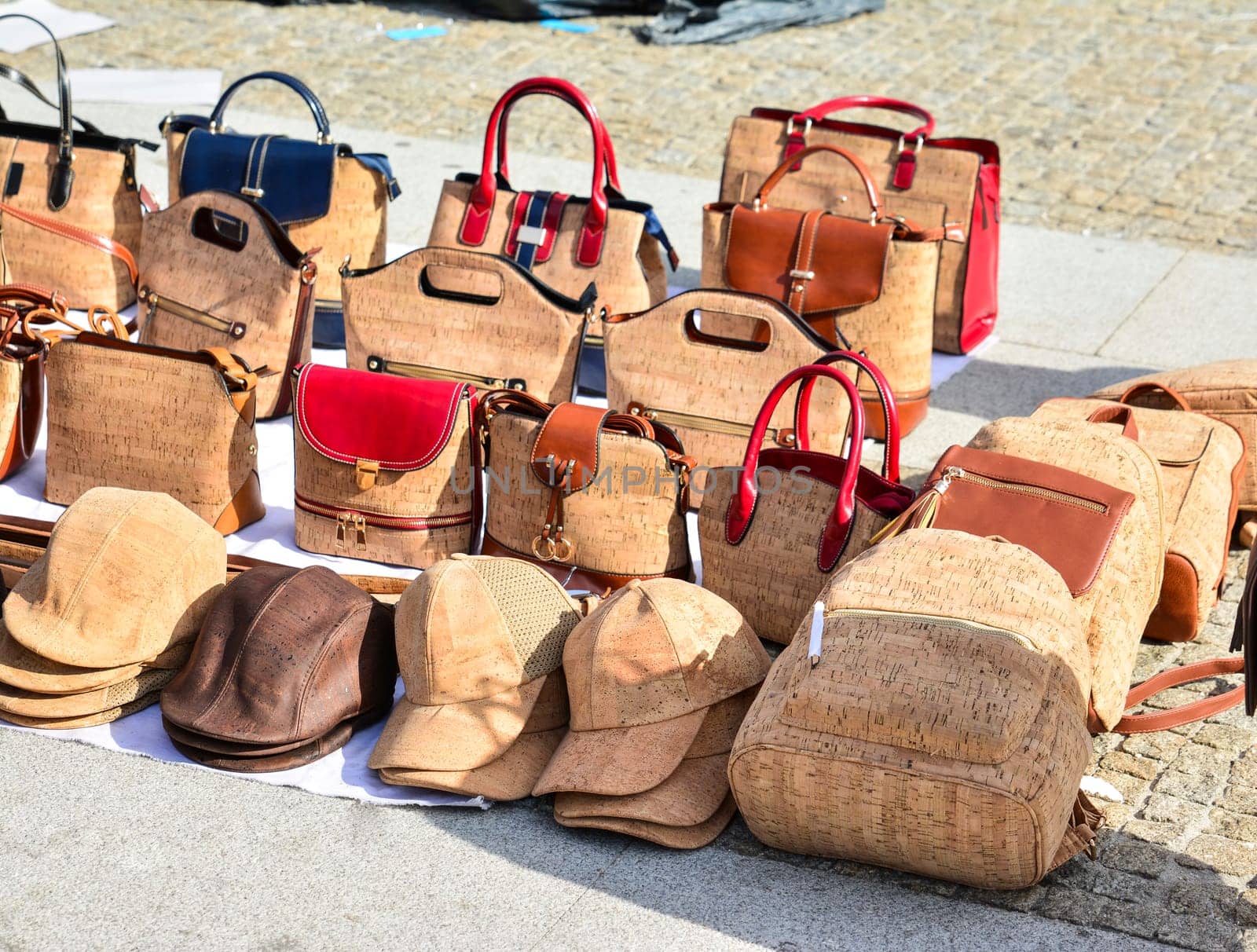 Variety of bags and souvenirs made from oak cork at the street market at Lisbon, Portugal. Porto