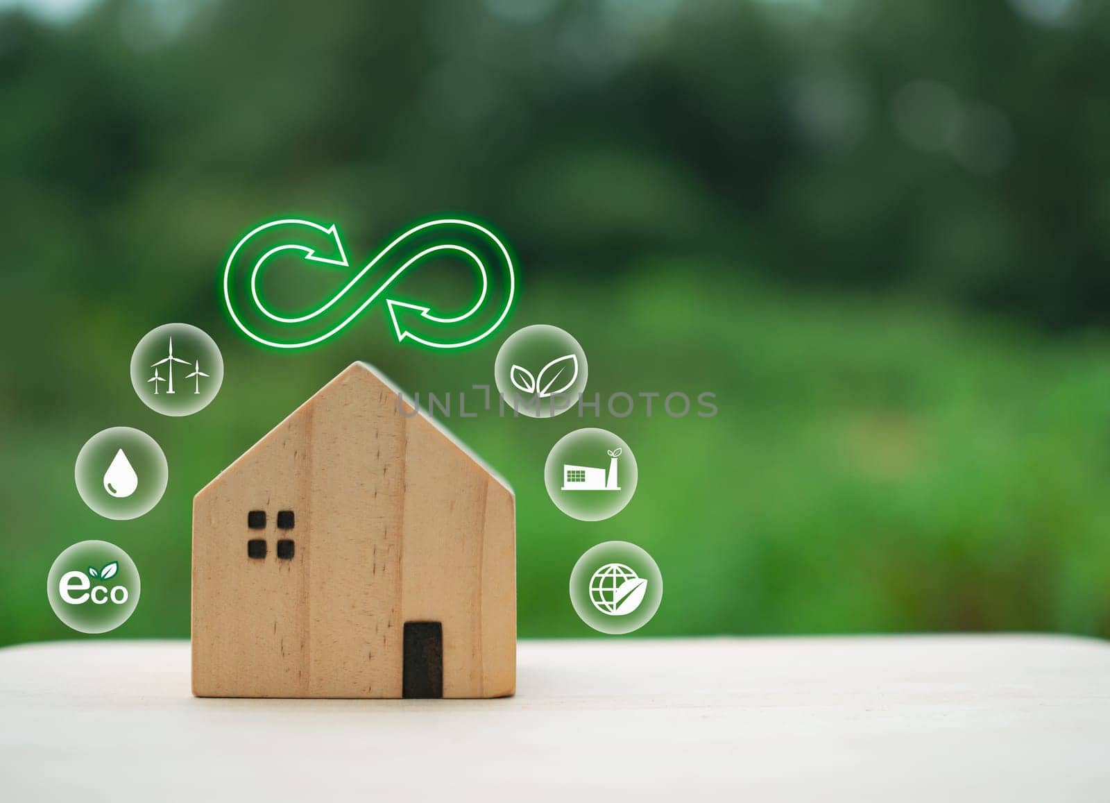Model wooden house with green recycle symbol on nature background. Recycling concept. environmental protection concept by Unimages2527