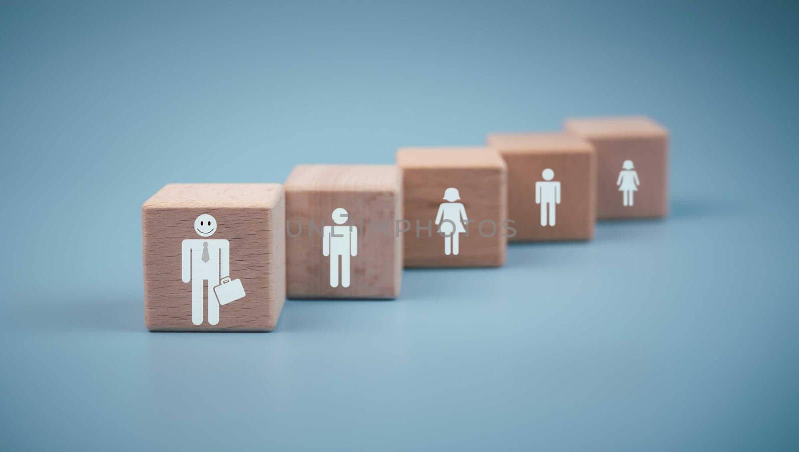 Concept Business and HR for leadership and team leader, one wooden dolls different and stand out from the group.