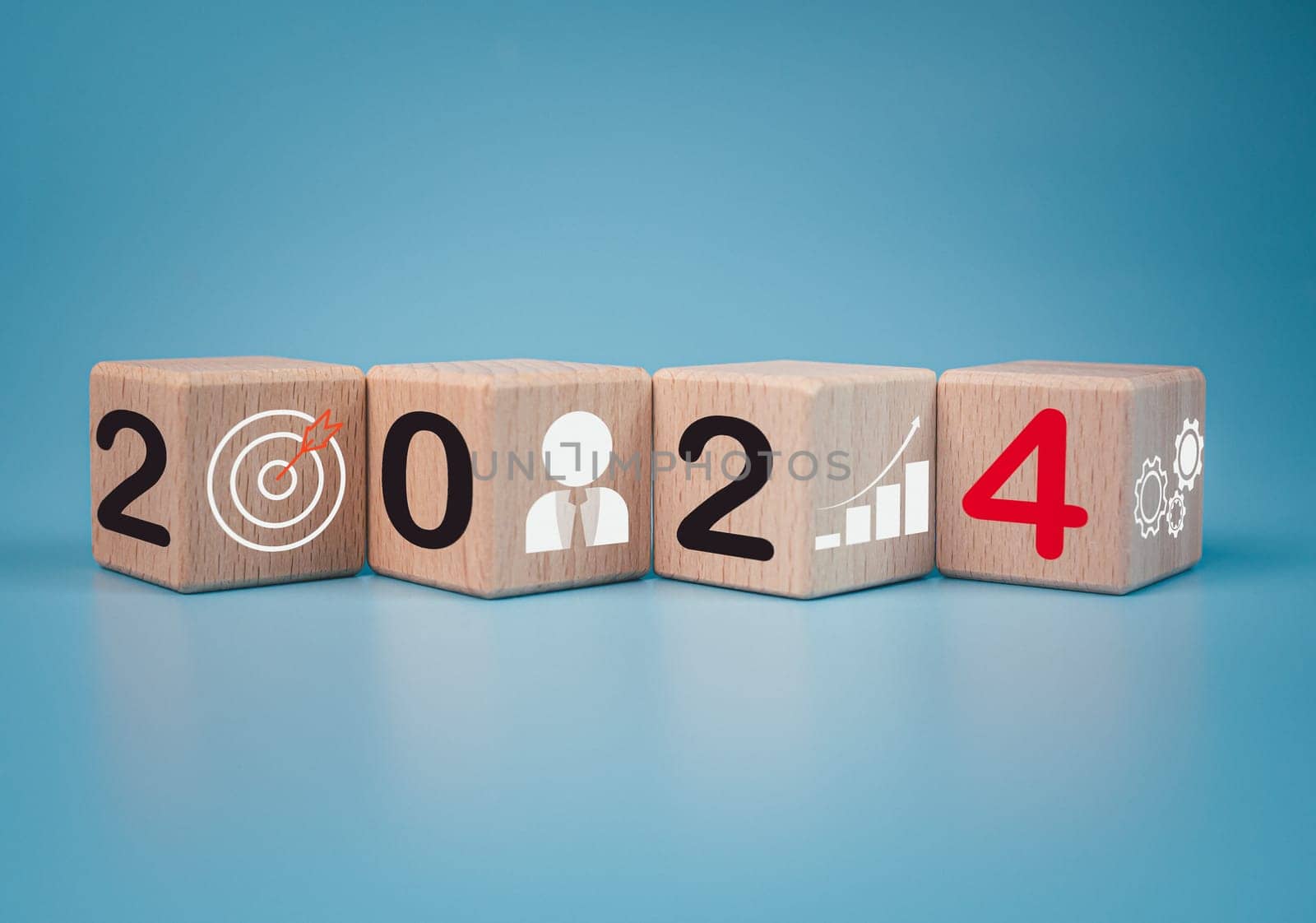 Wooden blocks lined up with the letters 2024. Represents the goal setting for 2024, the concept of a start. financial planning development strategy business goal setting by Unimages2527