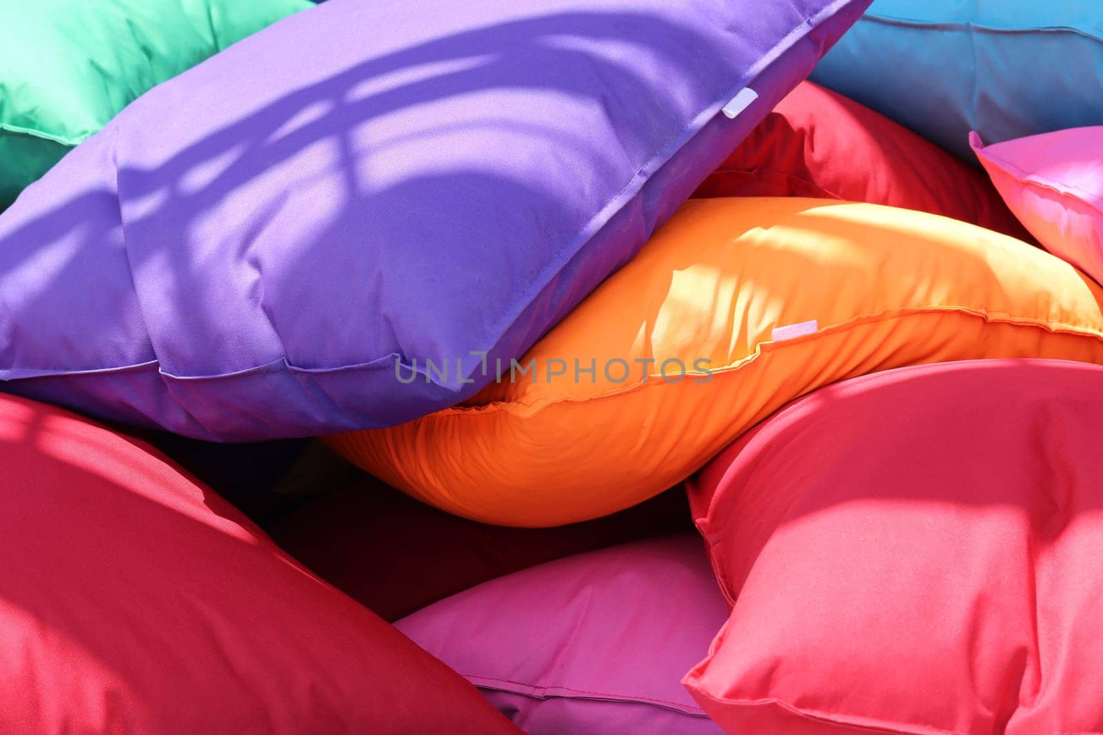 Scattered cushions in various colors.