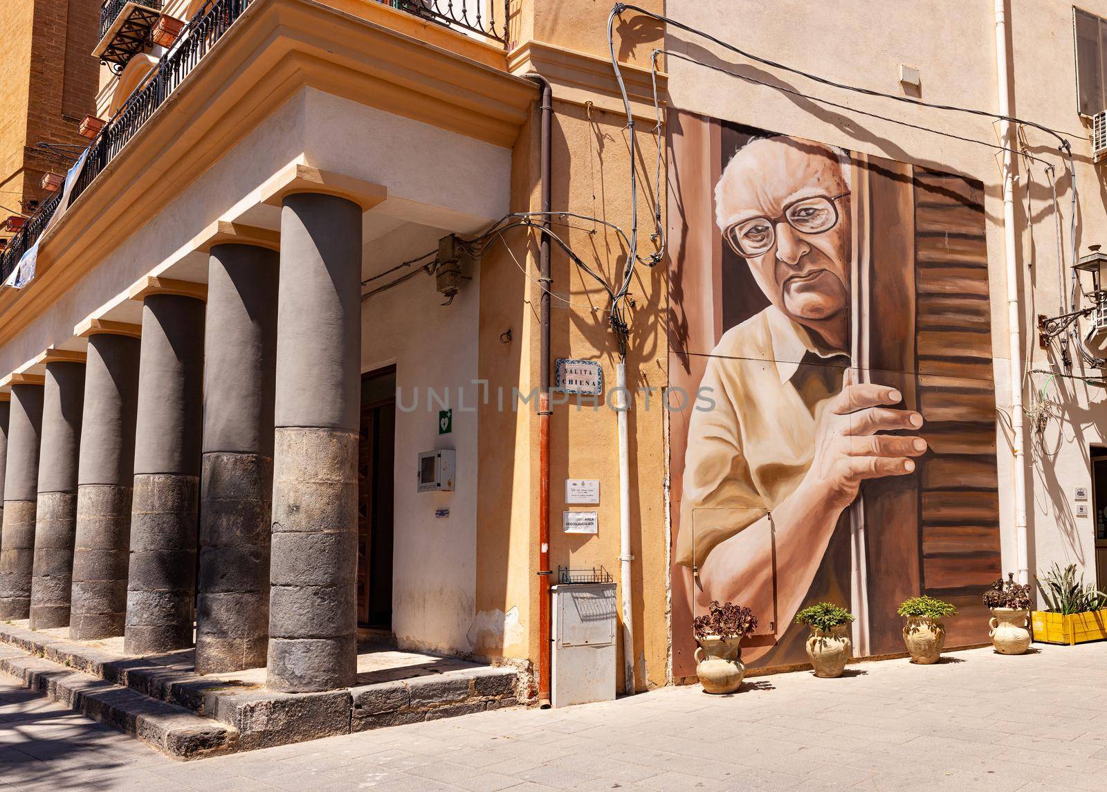 Porto Empedocle, Italy - July 22: View of the Murales tribute to the sicilian writer Andrea Camilleri painted by the street artist Salvo Ligama on July 22, 2021