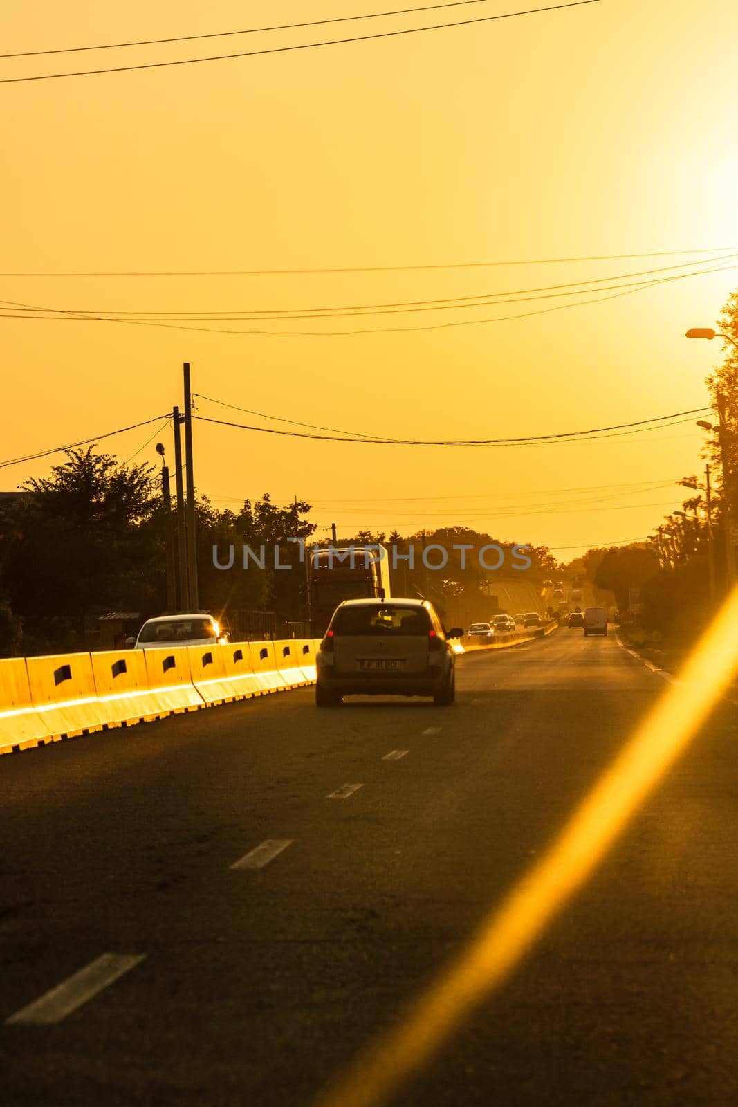 Car traffic at rush hour. Traffic jam, cars on the road at sunset in Bucharest, Romania, 2021