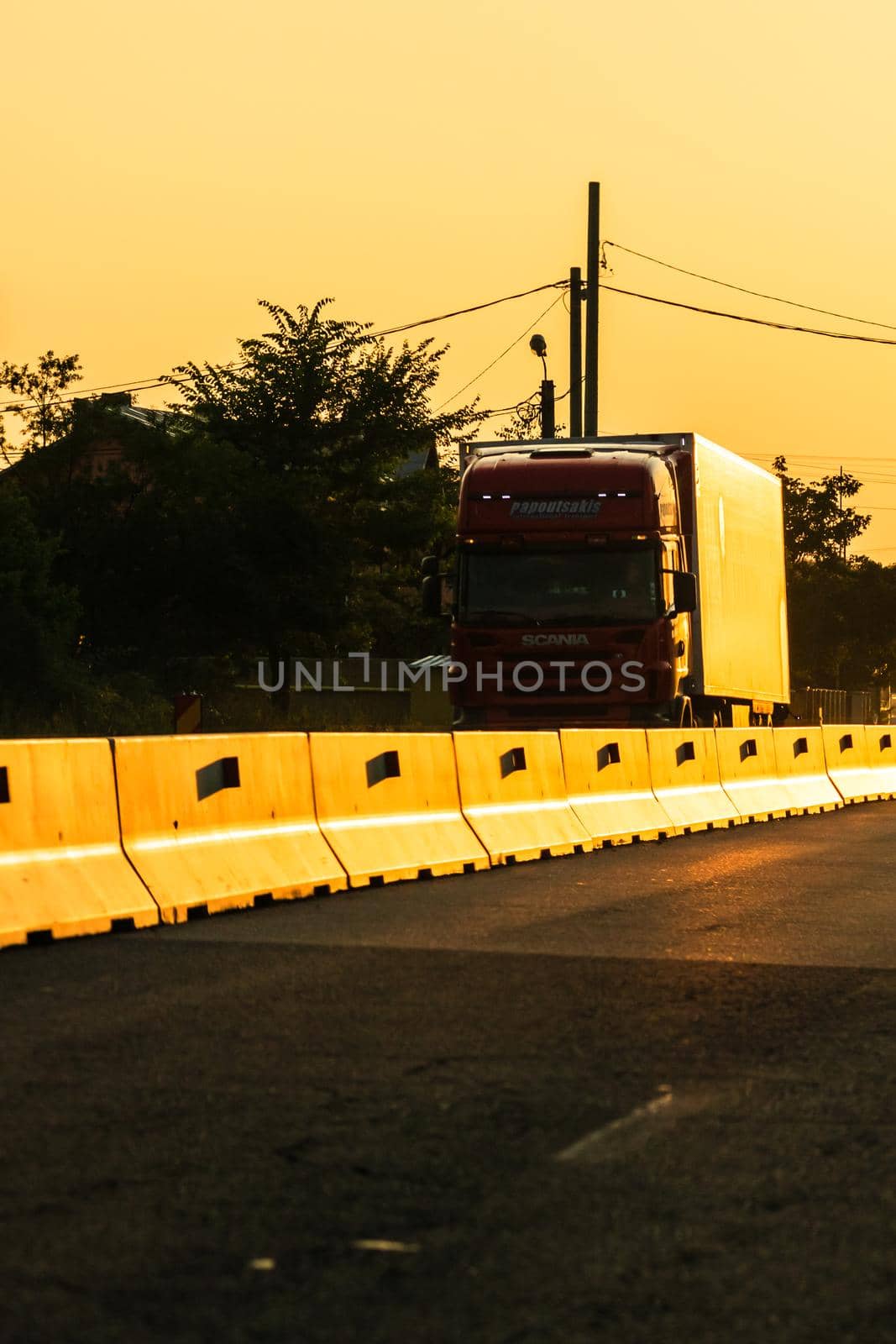 Car traffic at rush hour. Traffic jam, cars on the road at sunset in Bucharest, Romania, 2021 by vladispas