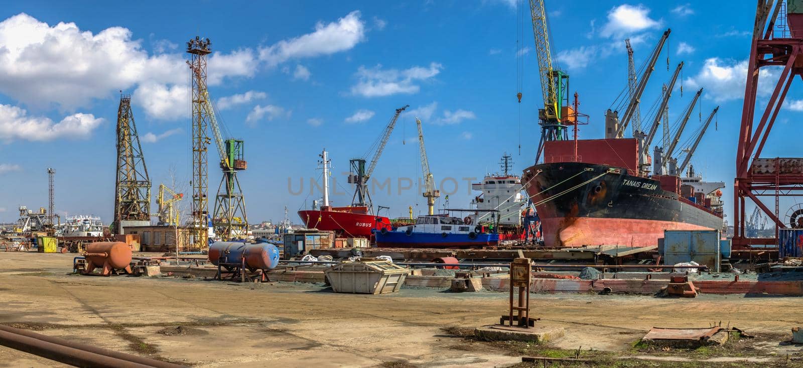 Chernomorsk, Ukraine. 21.03.2021. Big ships at the pier in the Chernomorsk Shipyard on a sunny spring day