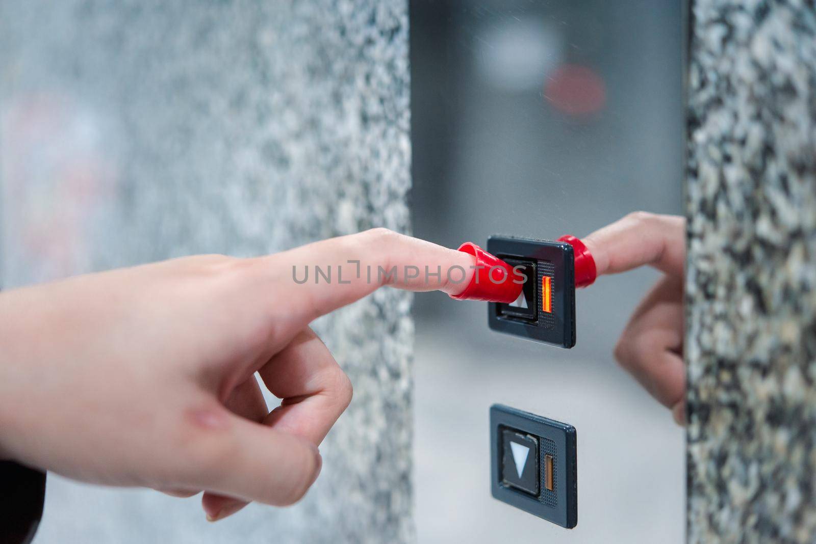 People use finger shield pressing button elevator by NongEngEng