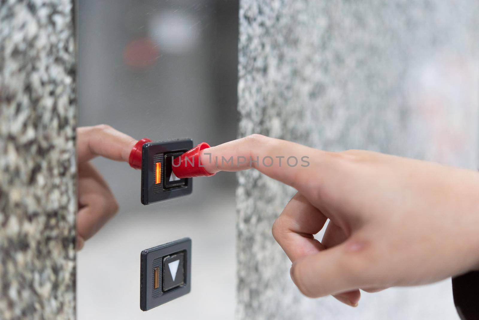 People use finger shield pressing button elevator by NongEngEng