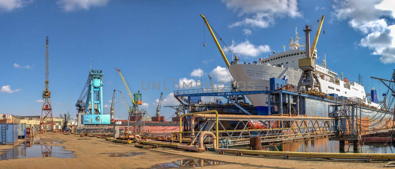 Chernomorsk, Ukraine. 21.03.2021. Large ship in dry dock of the Chernomorsk Shipyard on a sunny spring day