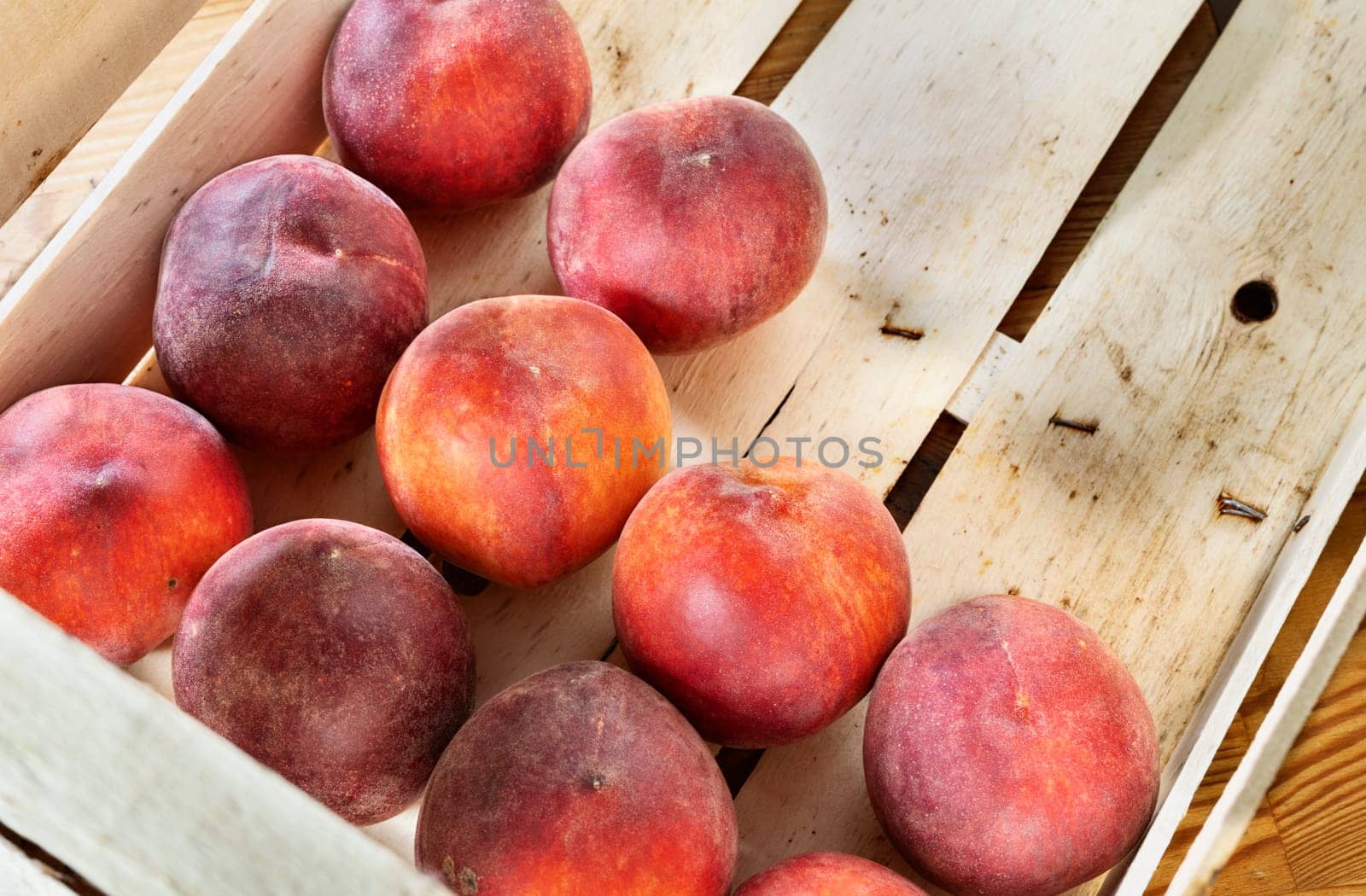 Ripe peaches  in wooden box by victimewalker