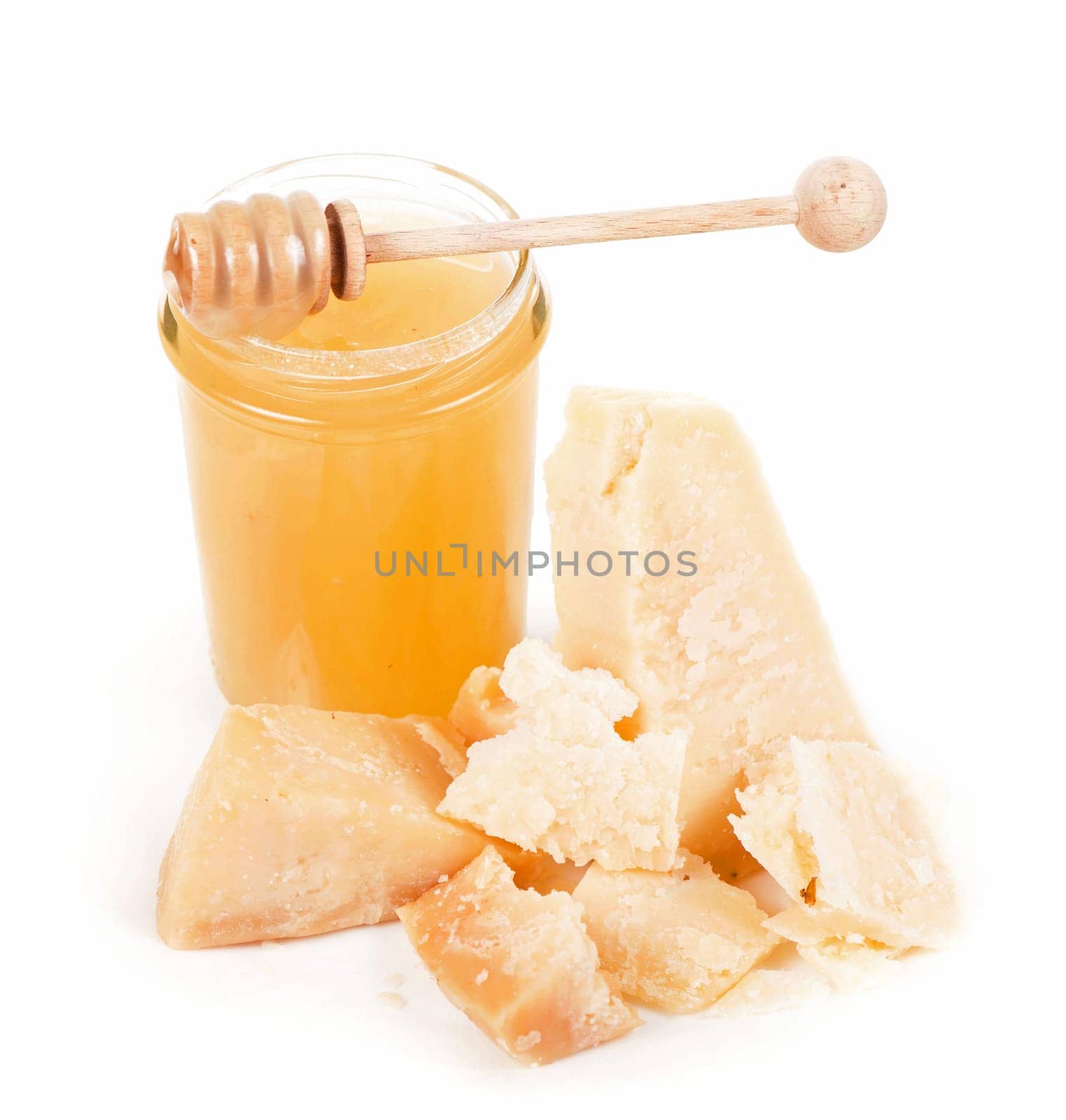 honey and prmesan isolated on the white background. honey Jar and barrel with a dripping drop of honey. Honey tasting set. still life studio photo by aprilphoto