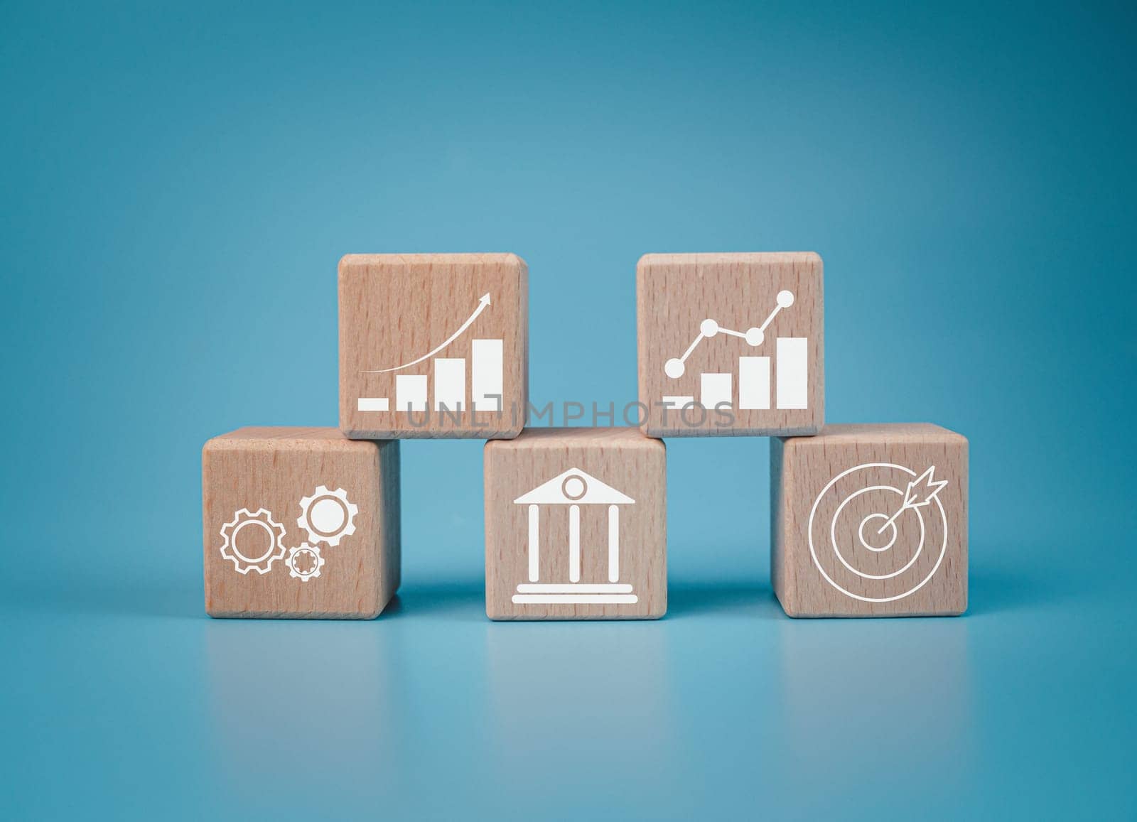 Wood cube block stacking with icon.Concept of business strategy and goal action plan. 