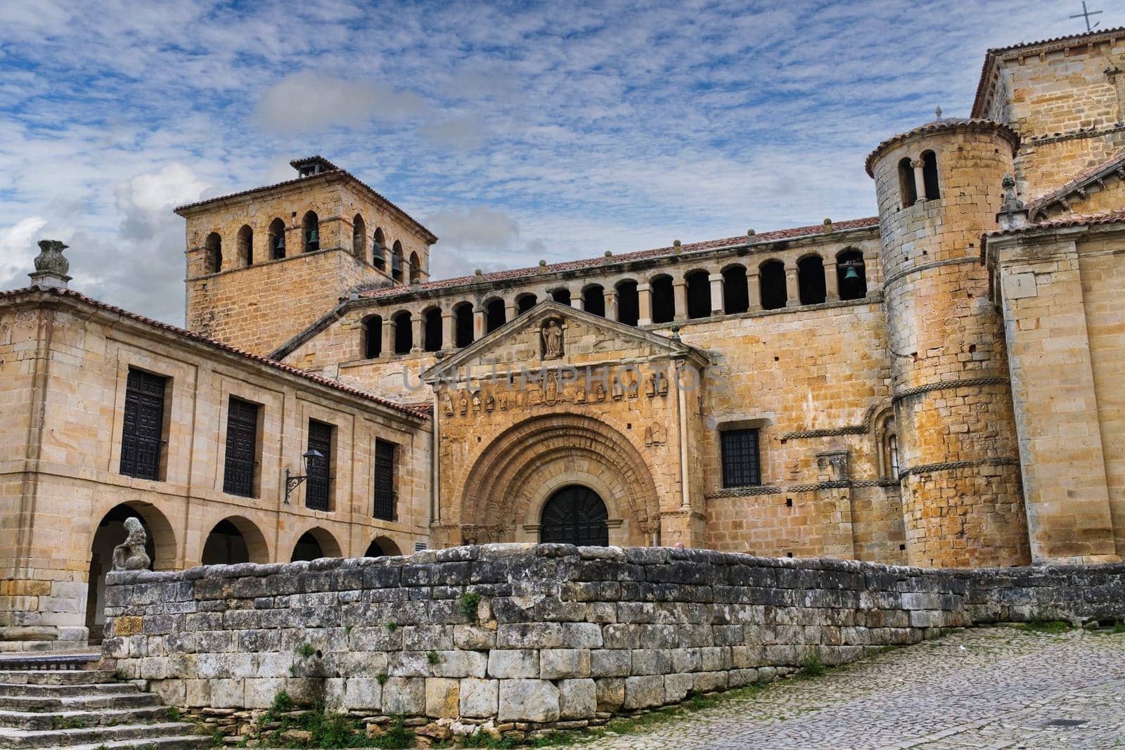 View of the main facade of the Romanesque collegiate church of Santillana del Mar. by csbphoto