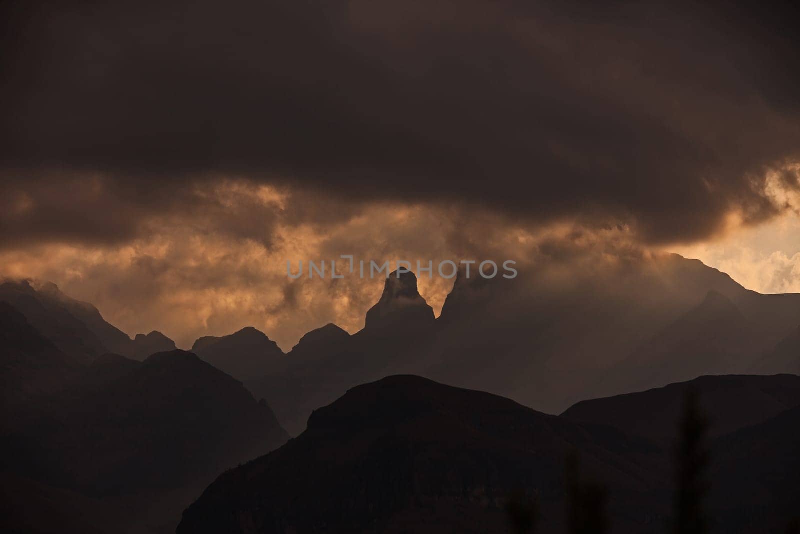 A stormy sunset at Cathedral Peak in the Drakensberg Mountains. KwaZulu-Natal Province, South Africa