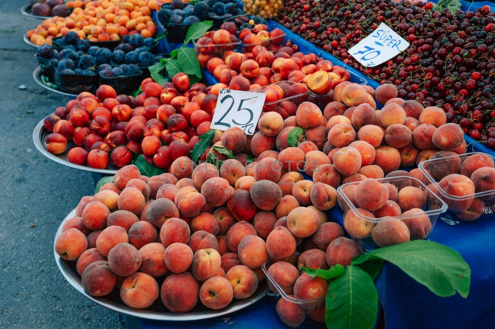 Nectarine sale in the traditional farm Turkish market, a counter filled with fresh fruits
