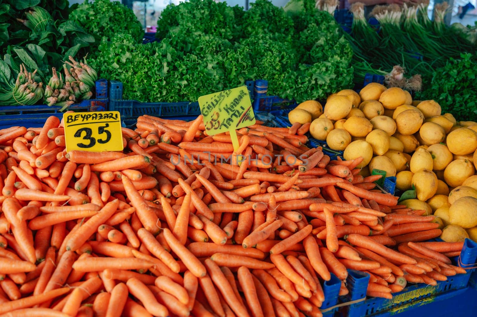 Carrot sale in the traditional farm Turkish market, a counter filled with fresh fruits