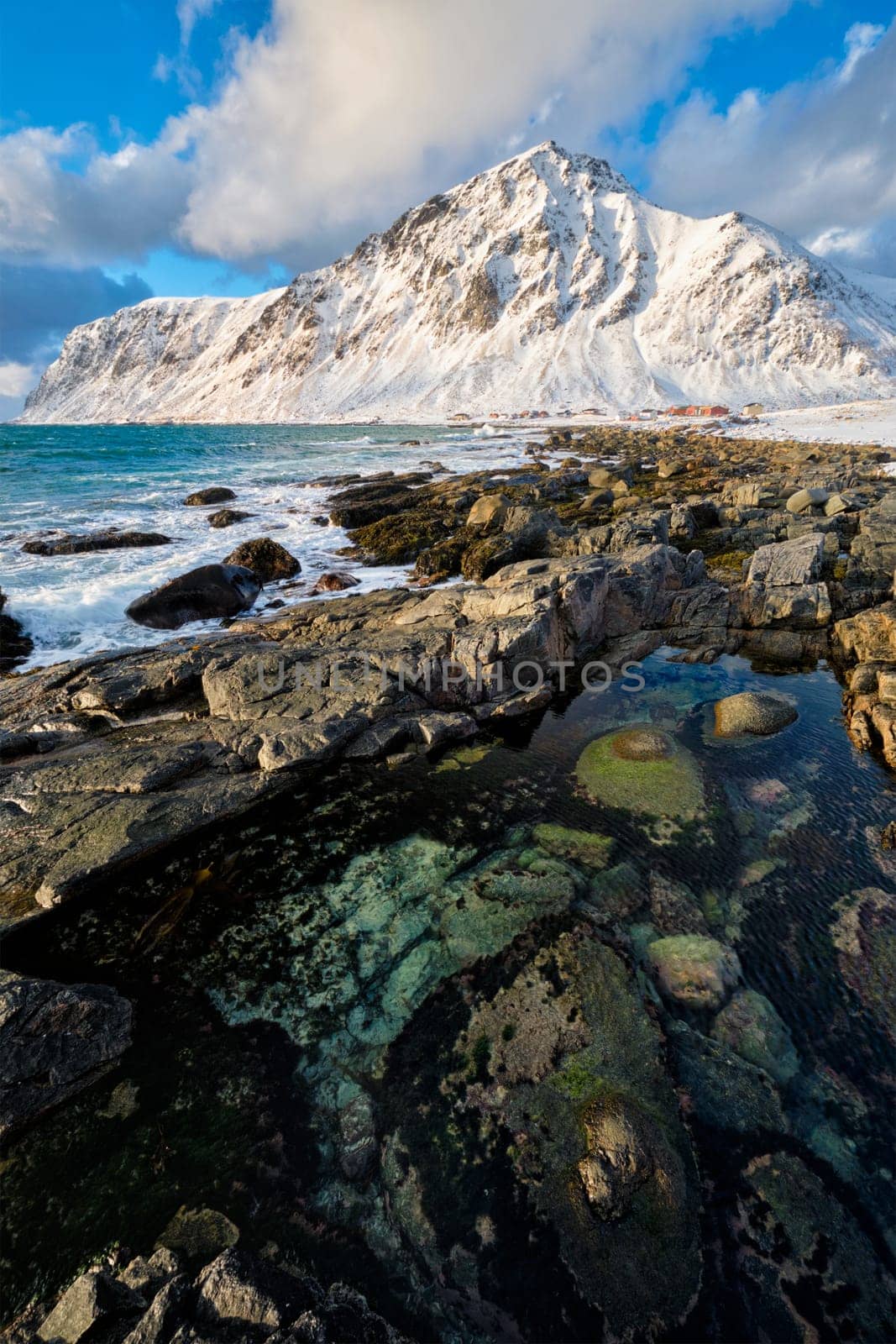 Coast of Norwegian sea on rocky coast in fjord on sunset by dimol