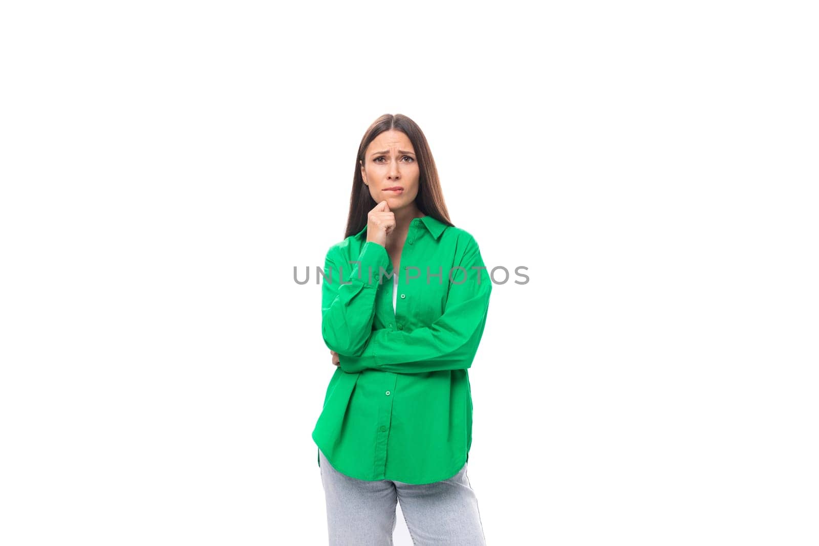 stylish slim young brunette woman with makeup in a green shirt on a white background with copy space by TRMK