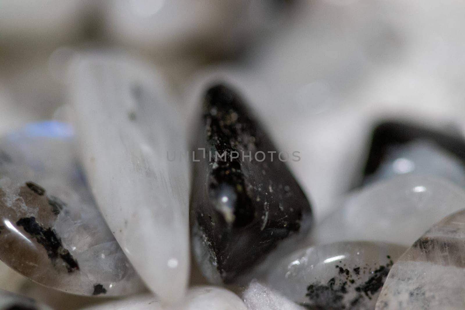 Black and white Moon stones close up view in a pile by gena_wells