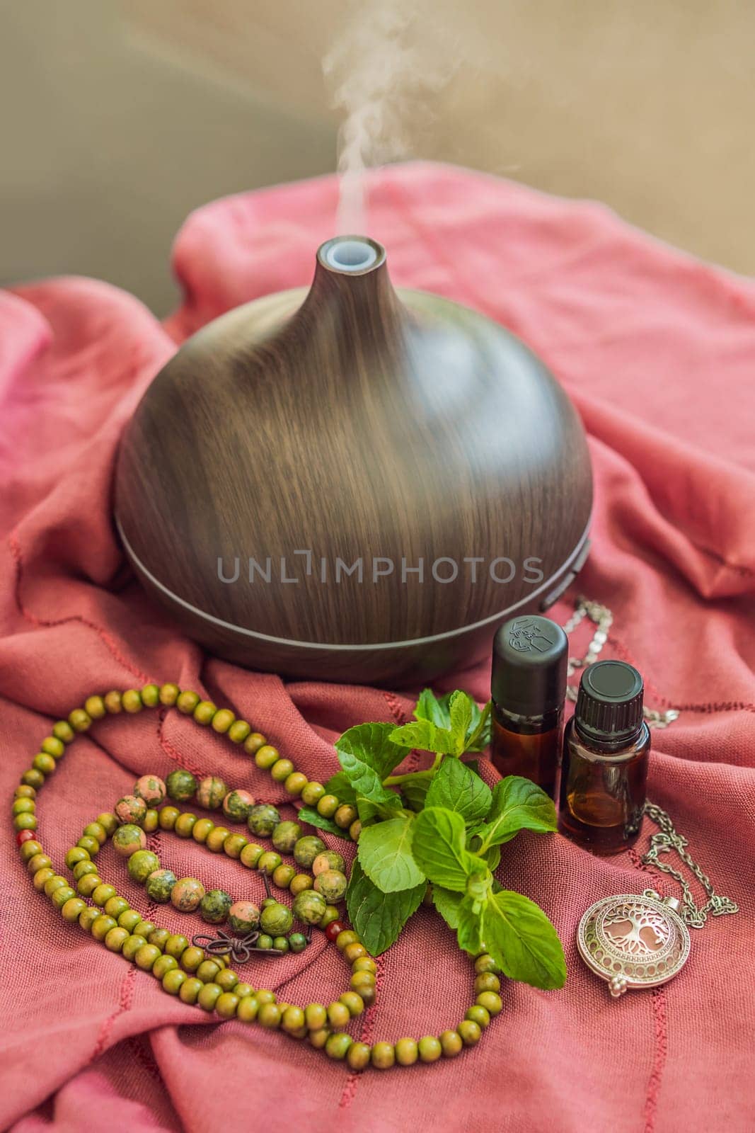 A captivating photo capturing the essence of relaxation and ambiance with an aroma oil and aroma diffuser, creating a soothing and serene atmosphere.