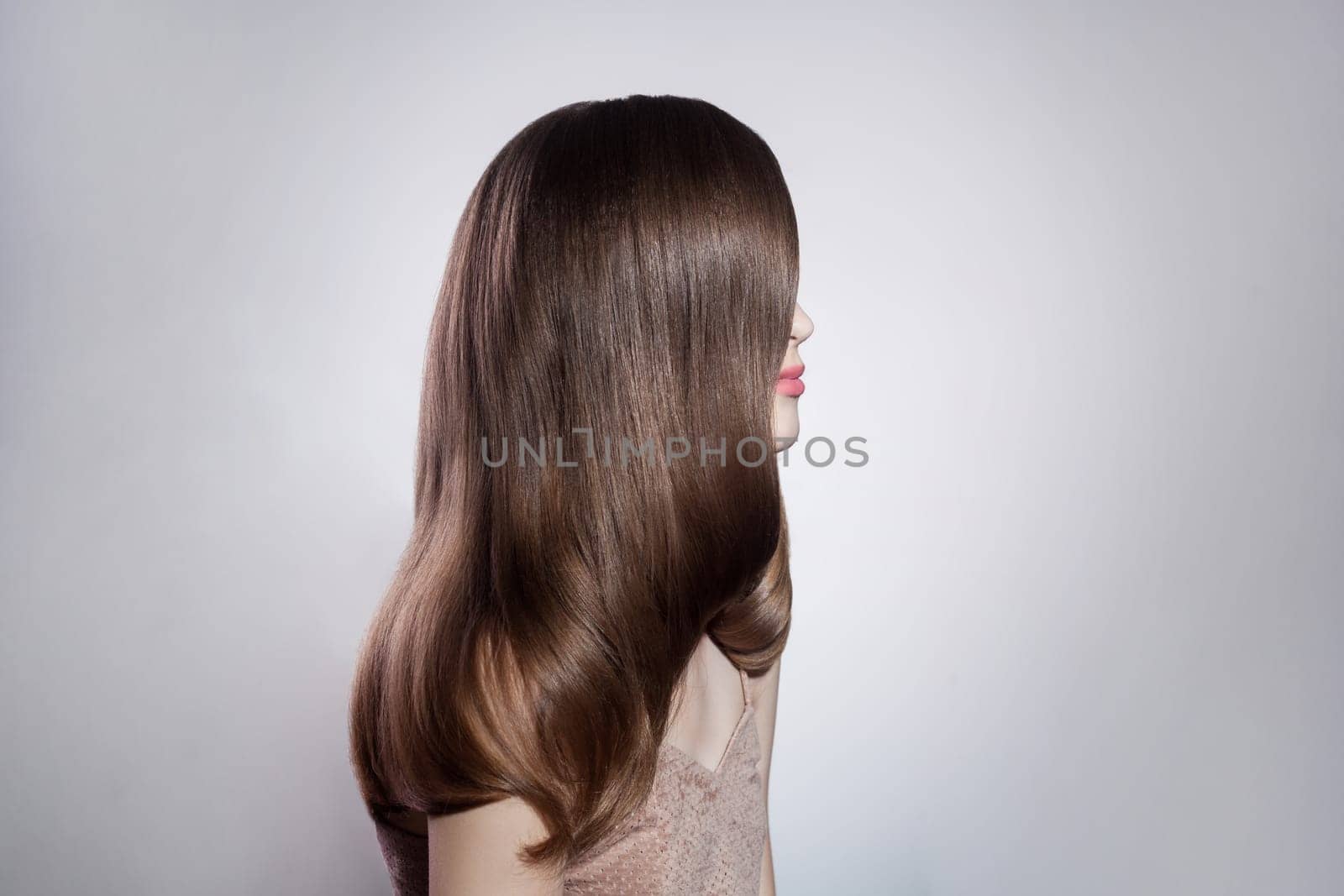 Brunette woman shiny hair and makeup, showing her hair after keratin and using new shampoo. by Khosro1