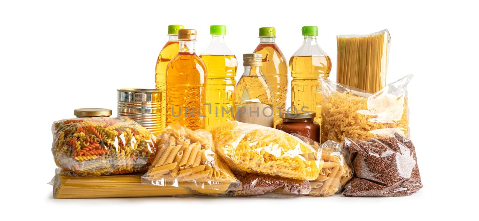 Foodstuff for donation, storage and delivery. Various food, pasta, cooking oil and canned food in cardboard box.