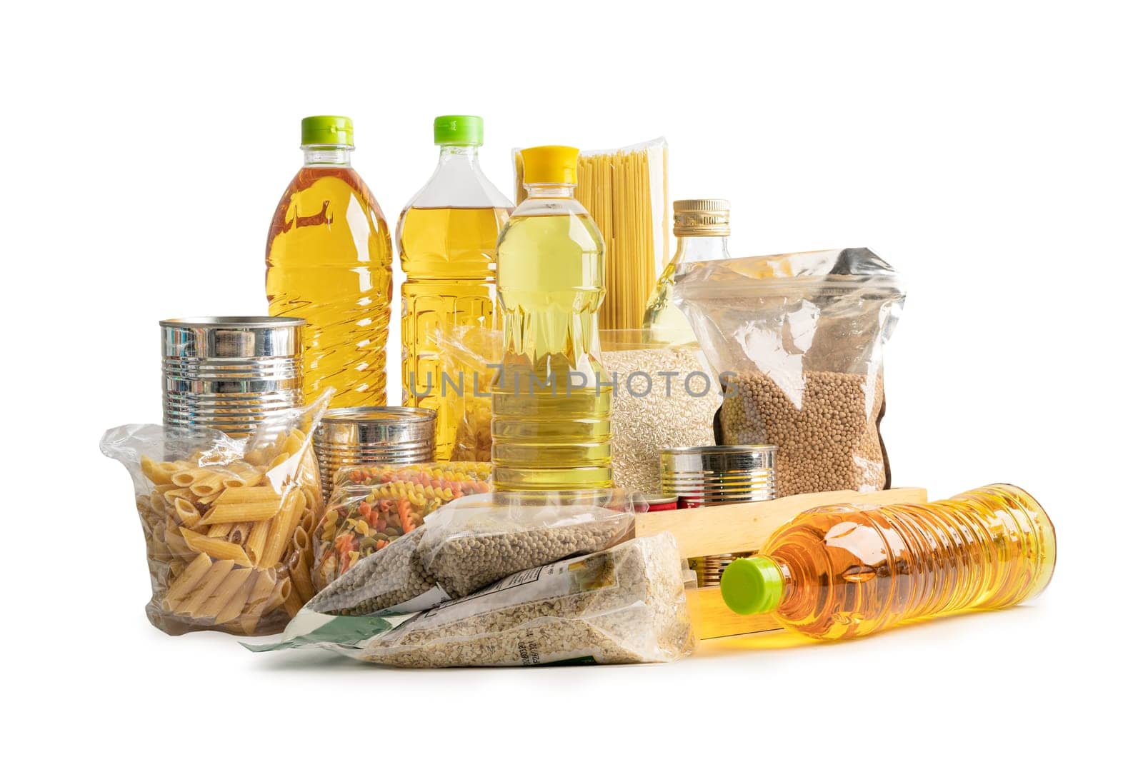 Foodstuff for donation, storage and delivery. Various food, pasta, cooking oil and canned food in cardboard box.