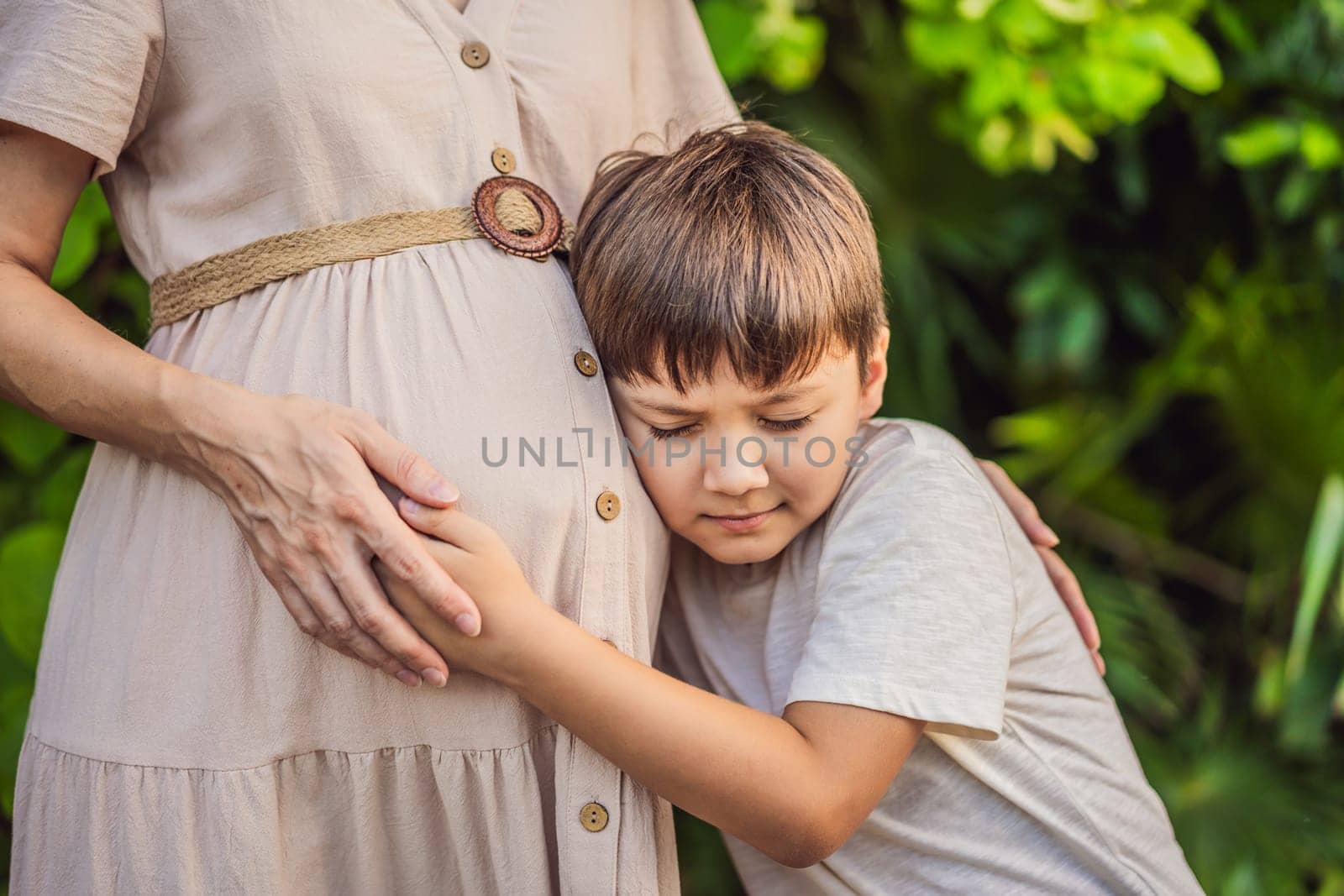 A heartwarming moment captured in the park as a pregnant woman after 40 shares a special bond with her teenage son, embracing the beauty of mother-daughter connection.