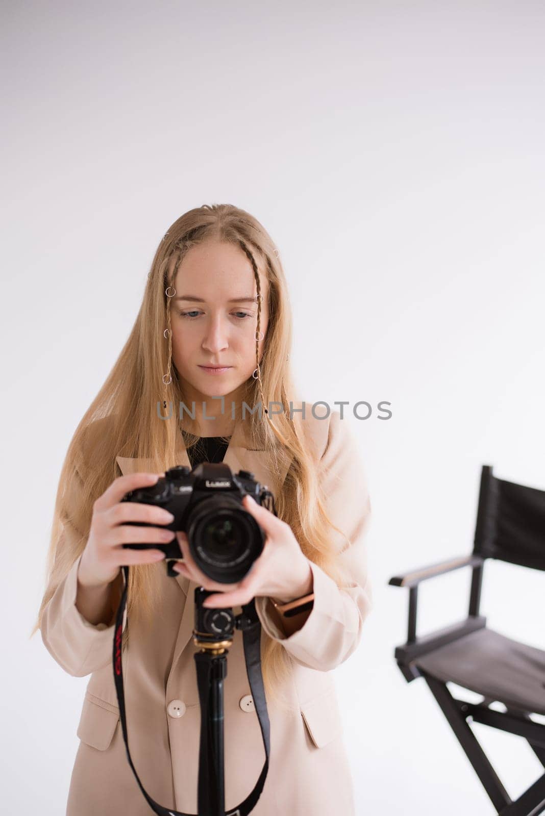 Woman videographer shoots in photo studio by OksanaFedorchuk