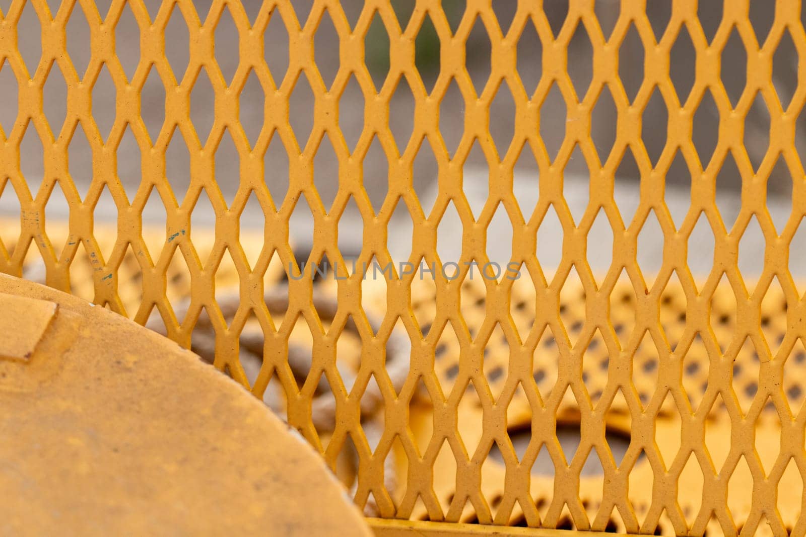 steel mesh background close up of belt guard cover on machine . High quality photo