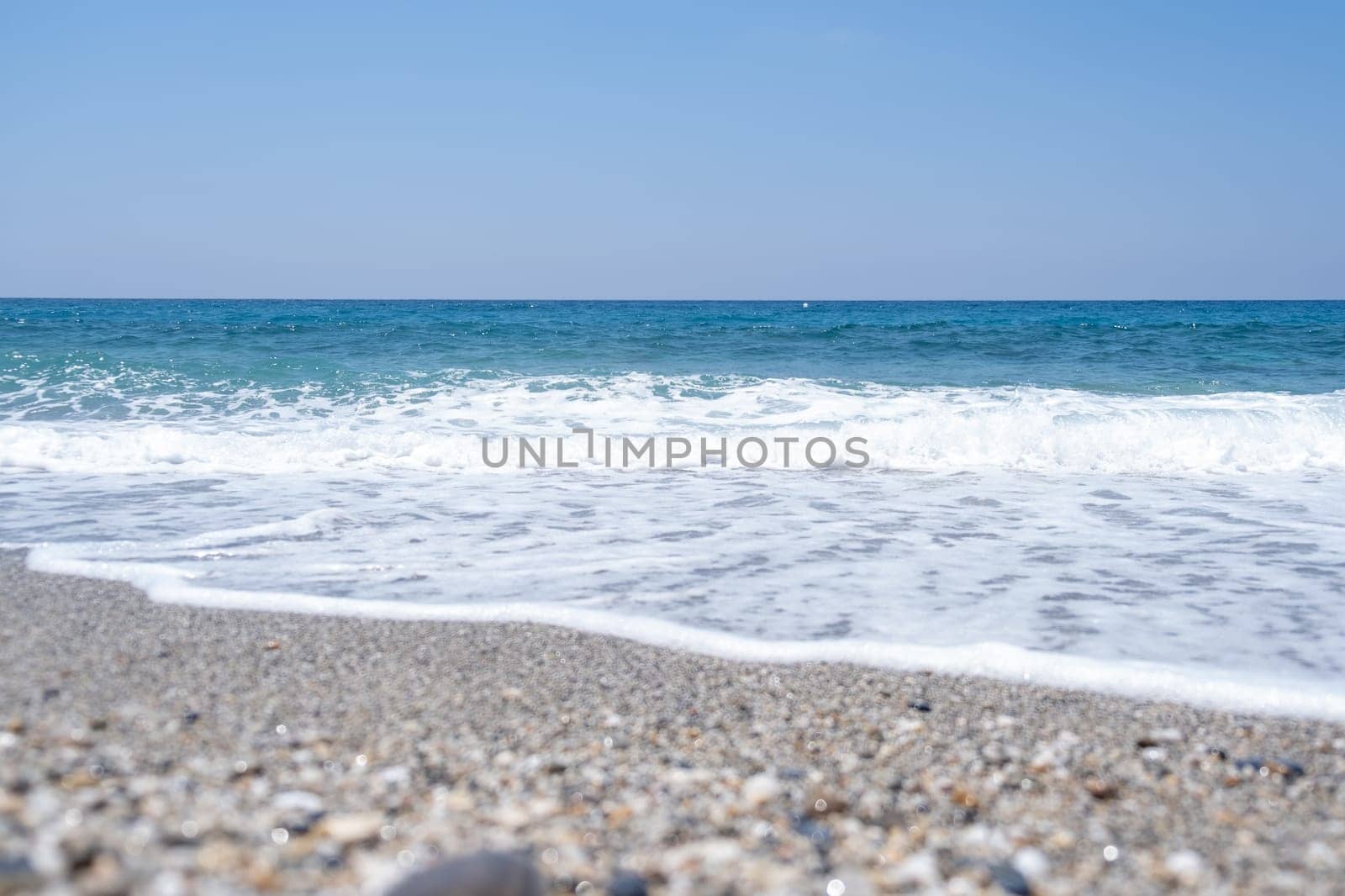 Sea waves run on the shore of the sea or ocean. by AnatoliiFoto