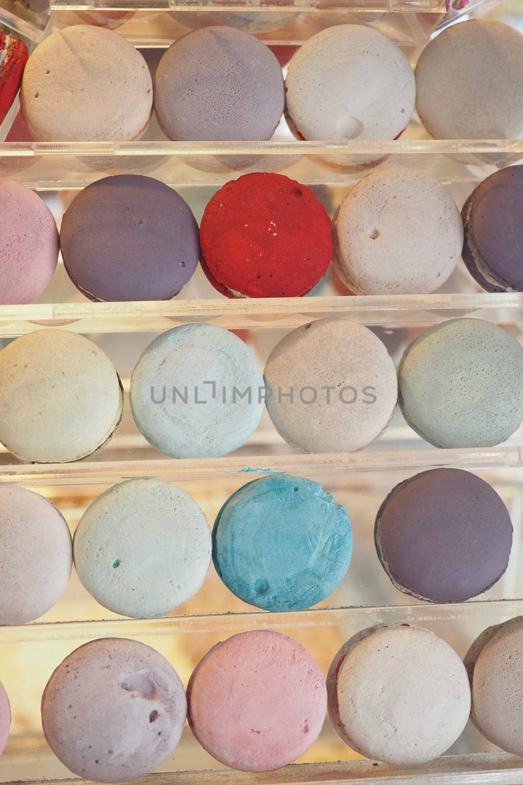 colorful macaroon lined up at shop .