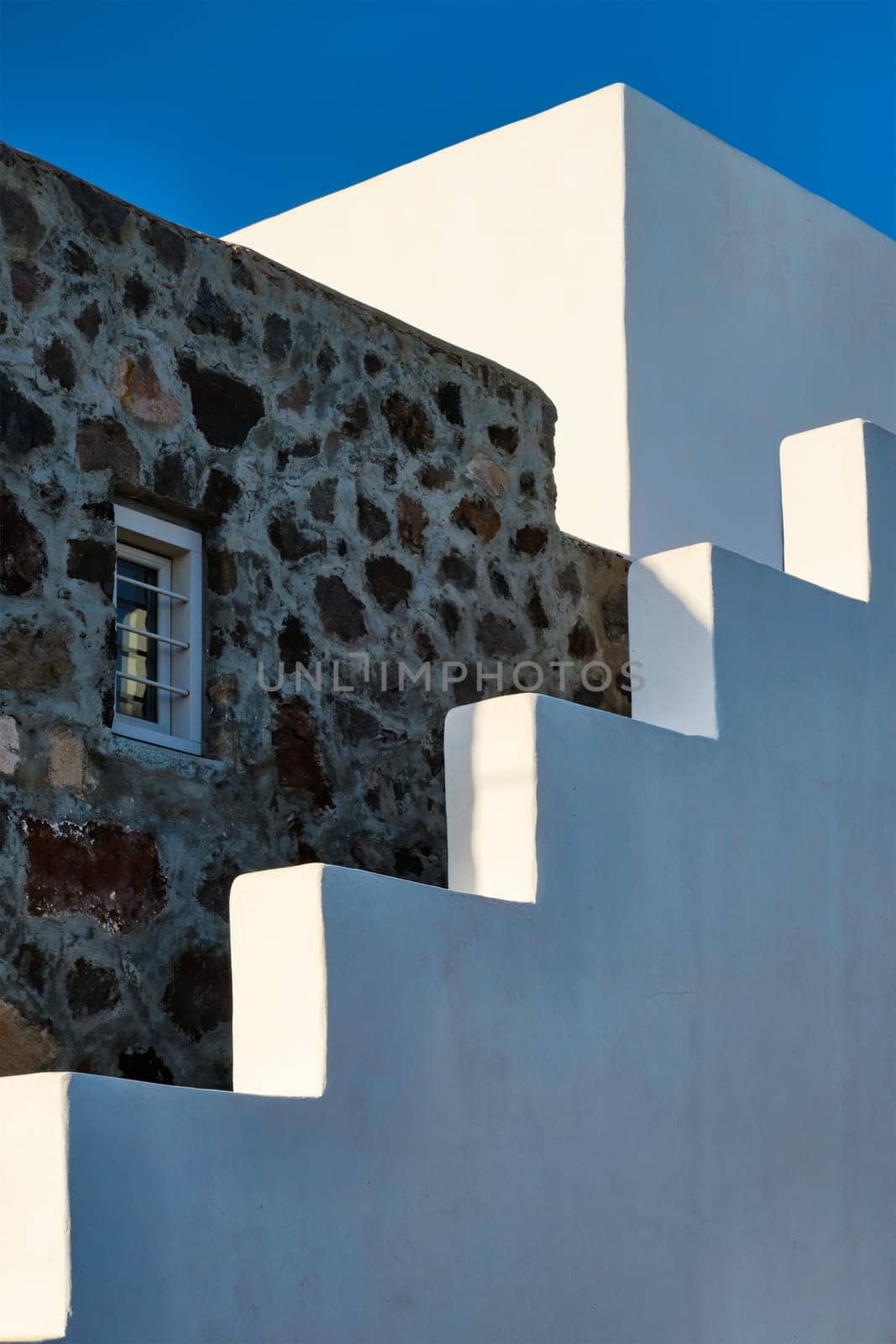 Greek architecture abstract background - whitewashed house with stairs. Milos island, Greece by dimol