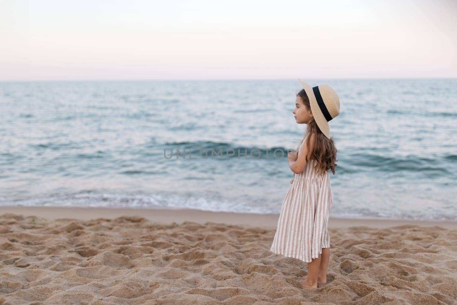 Little girl enjoying summer vacation at the sea by malyshph