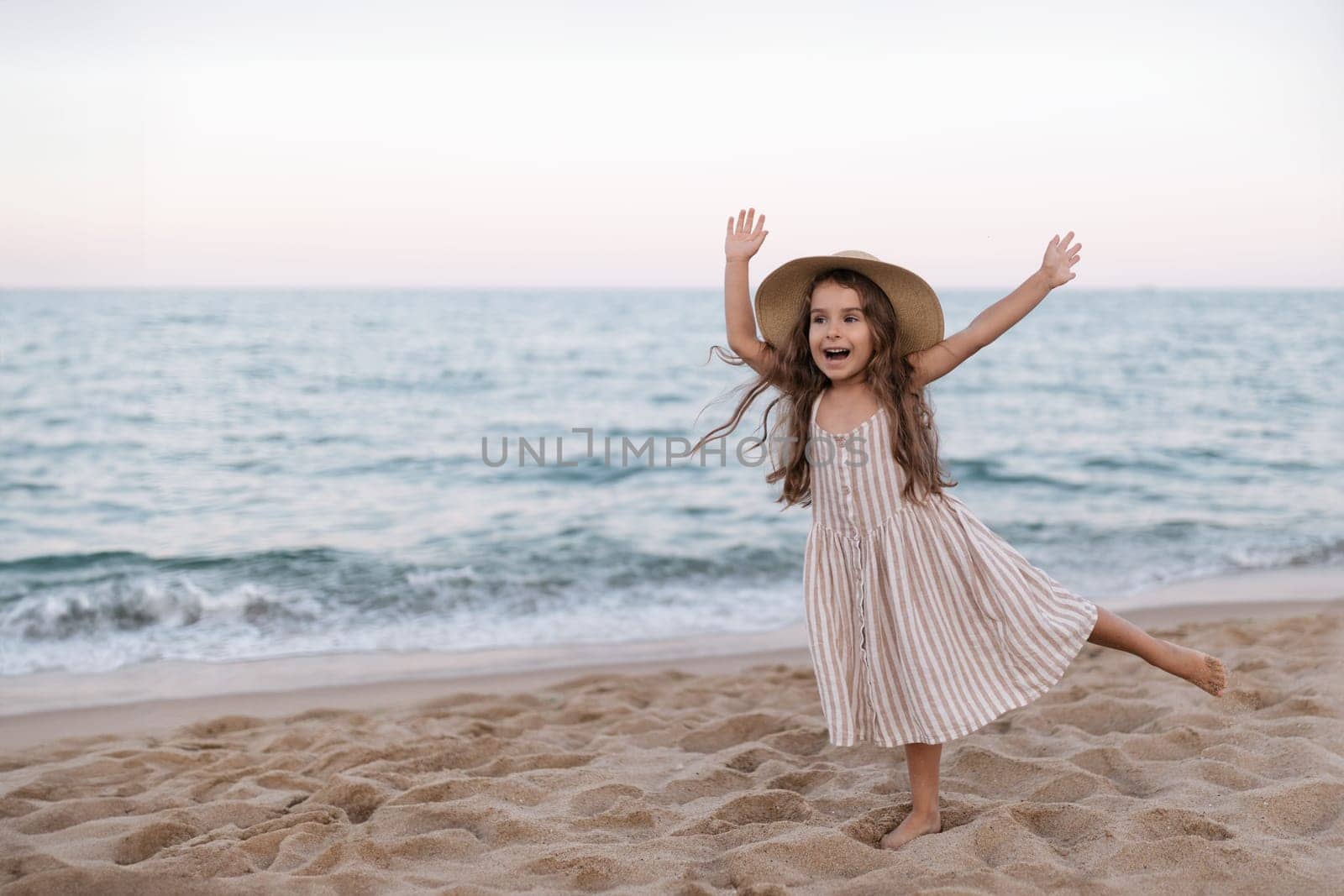 Little girl enjoying summer vacation at the sea by malyshph