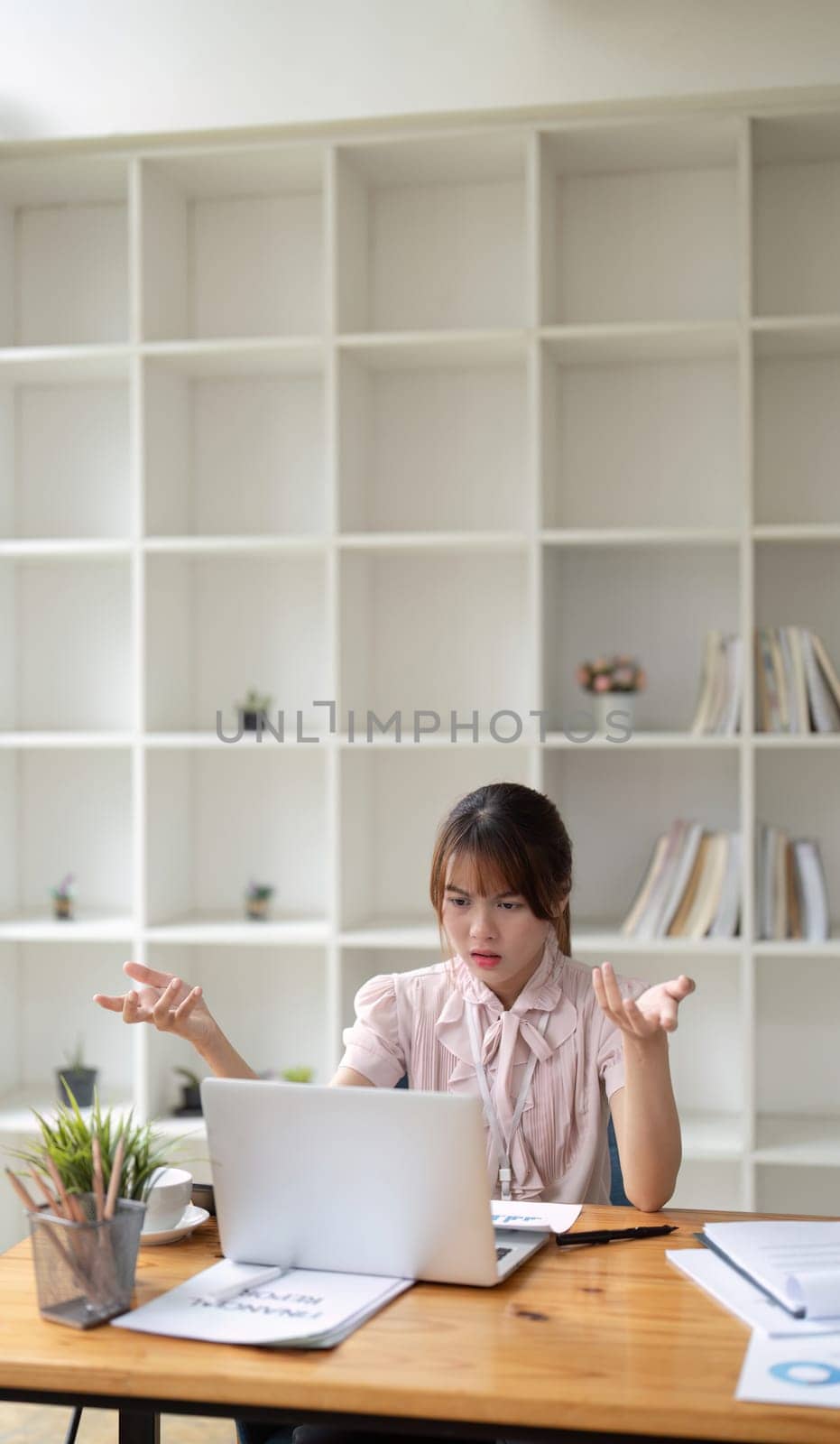 Asian business woman got stressed at work during in the office room, stressed face while working.
