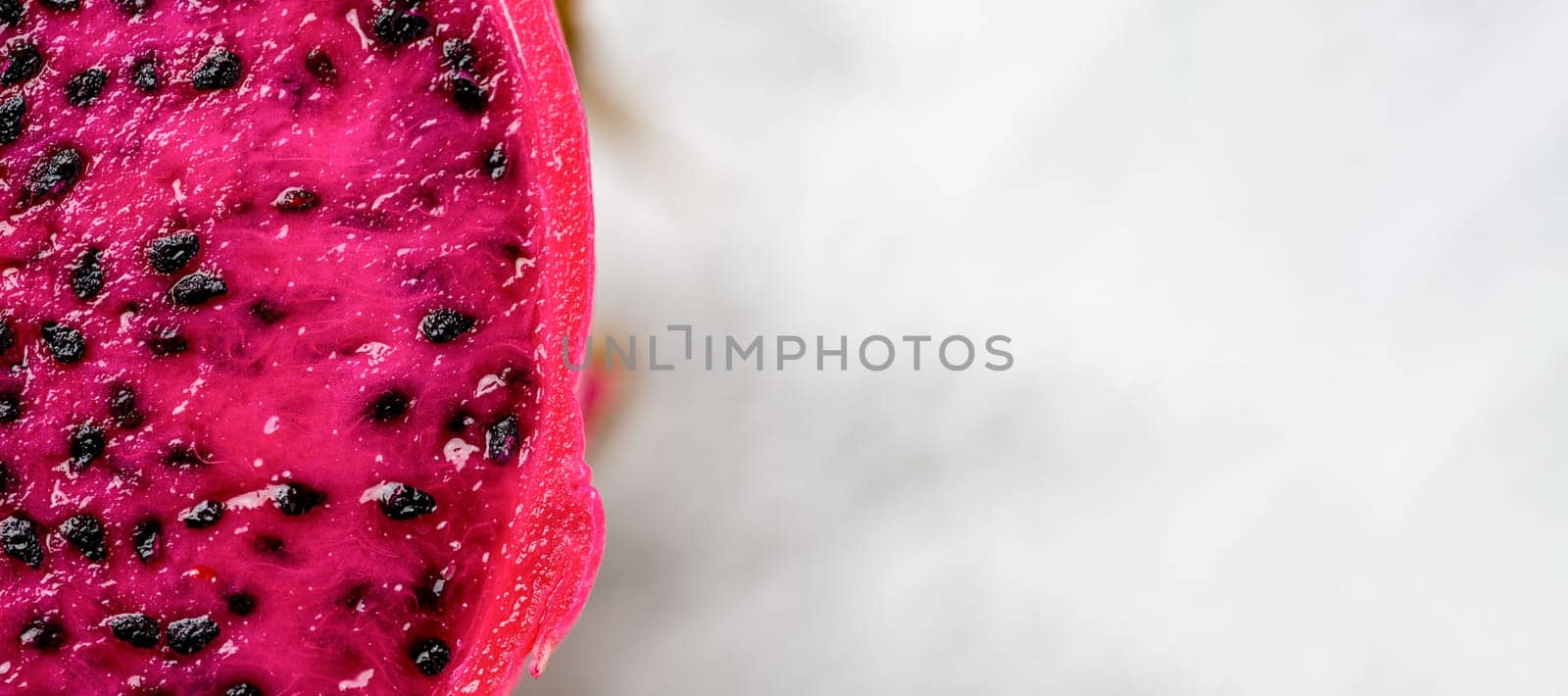 Ripe red dragon fruit on an isolated white background by Sonat