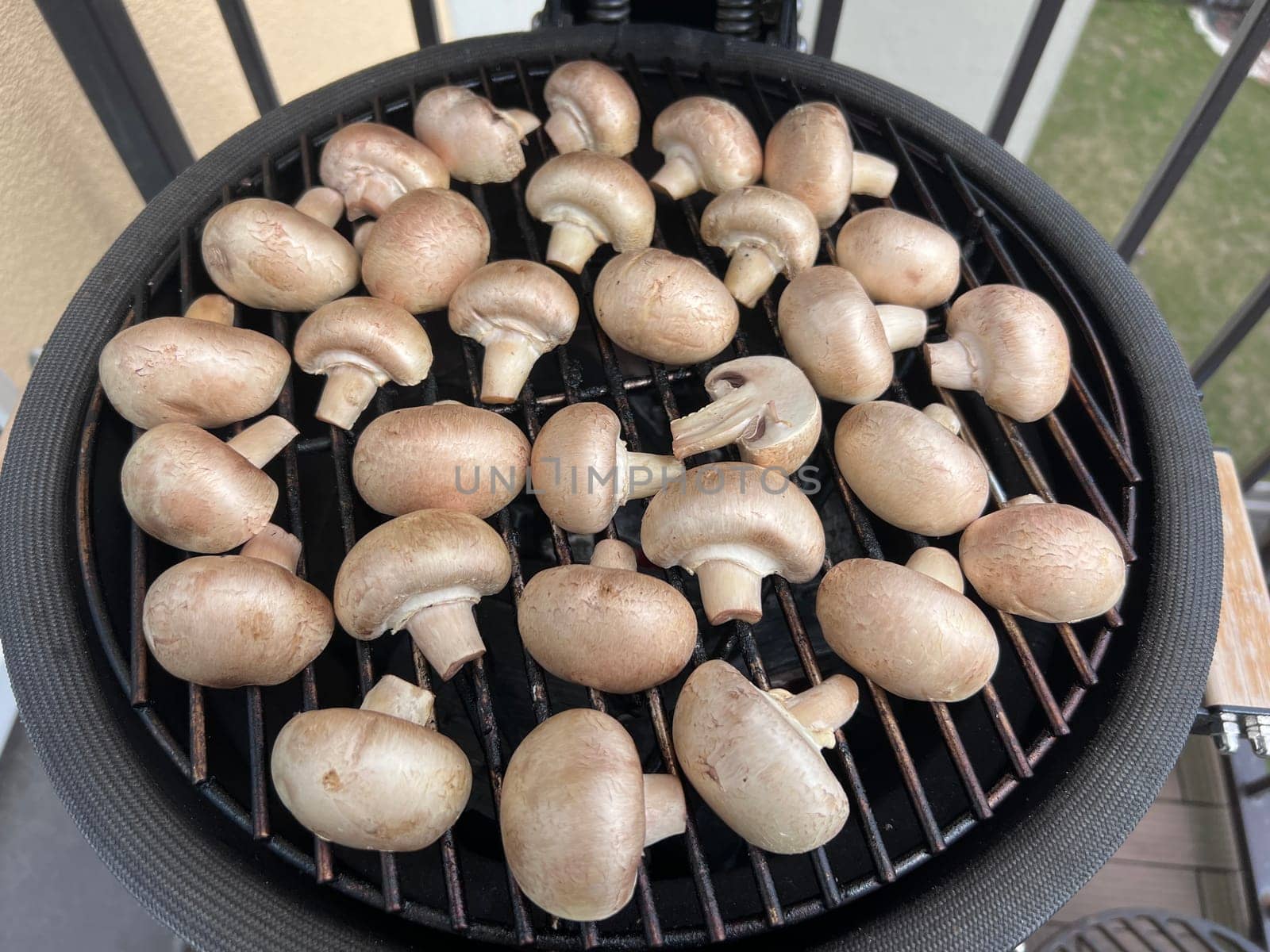 Raw champignon mushroom in bbq grill homemade juicy. High quality photo