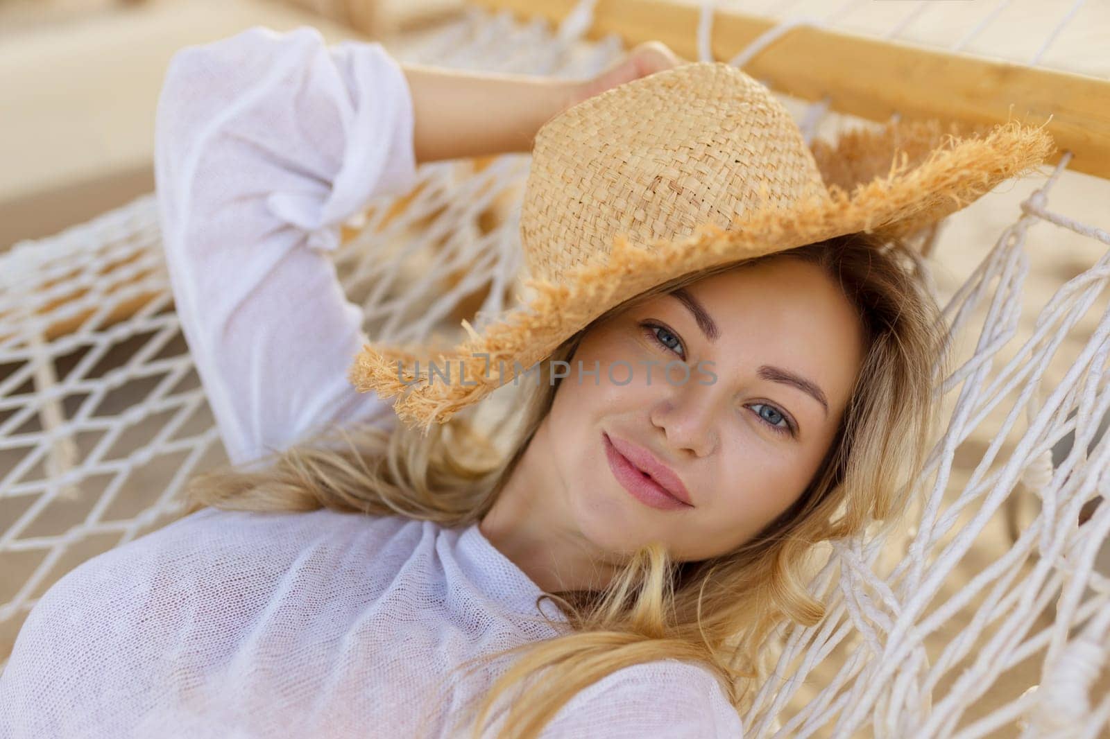 Young beautiful woman relaxing on the hammock by malyshph