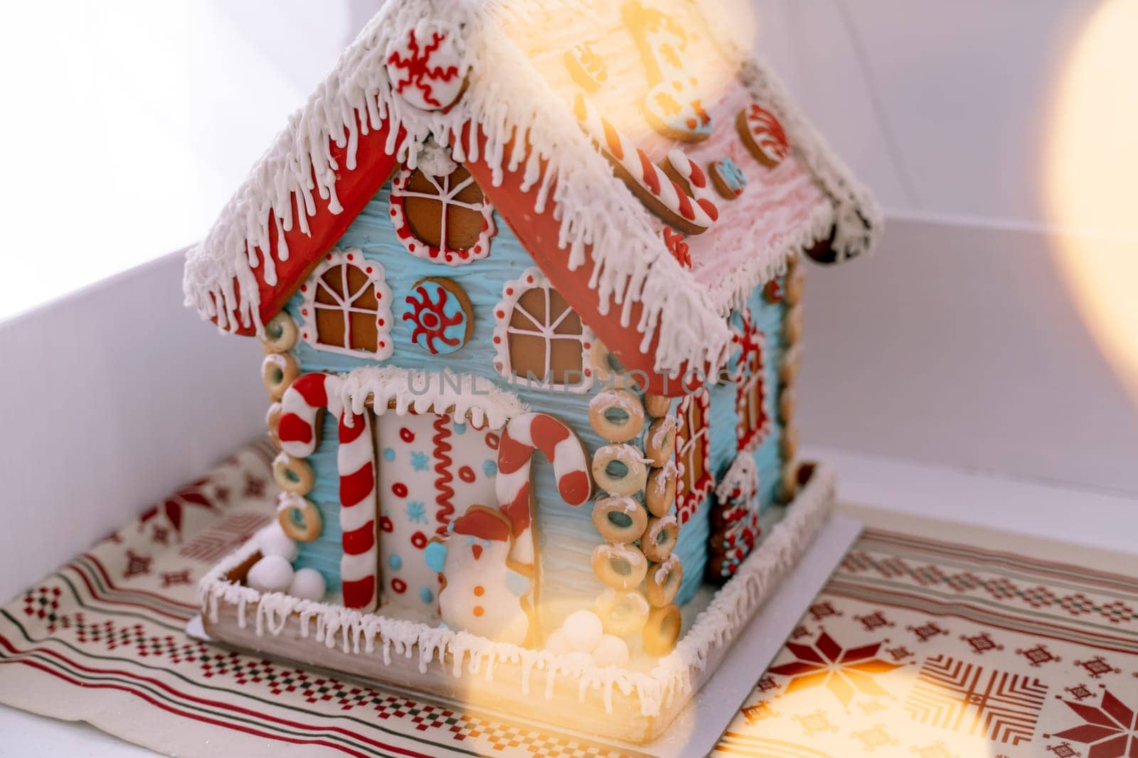 The hand-made eatable gingerbread house and snow decoration by Matiunina