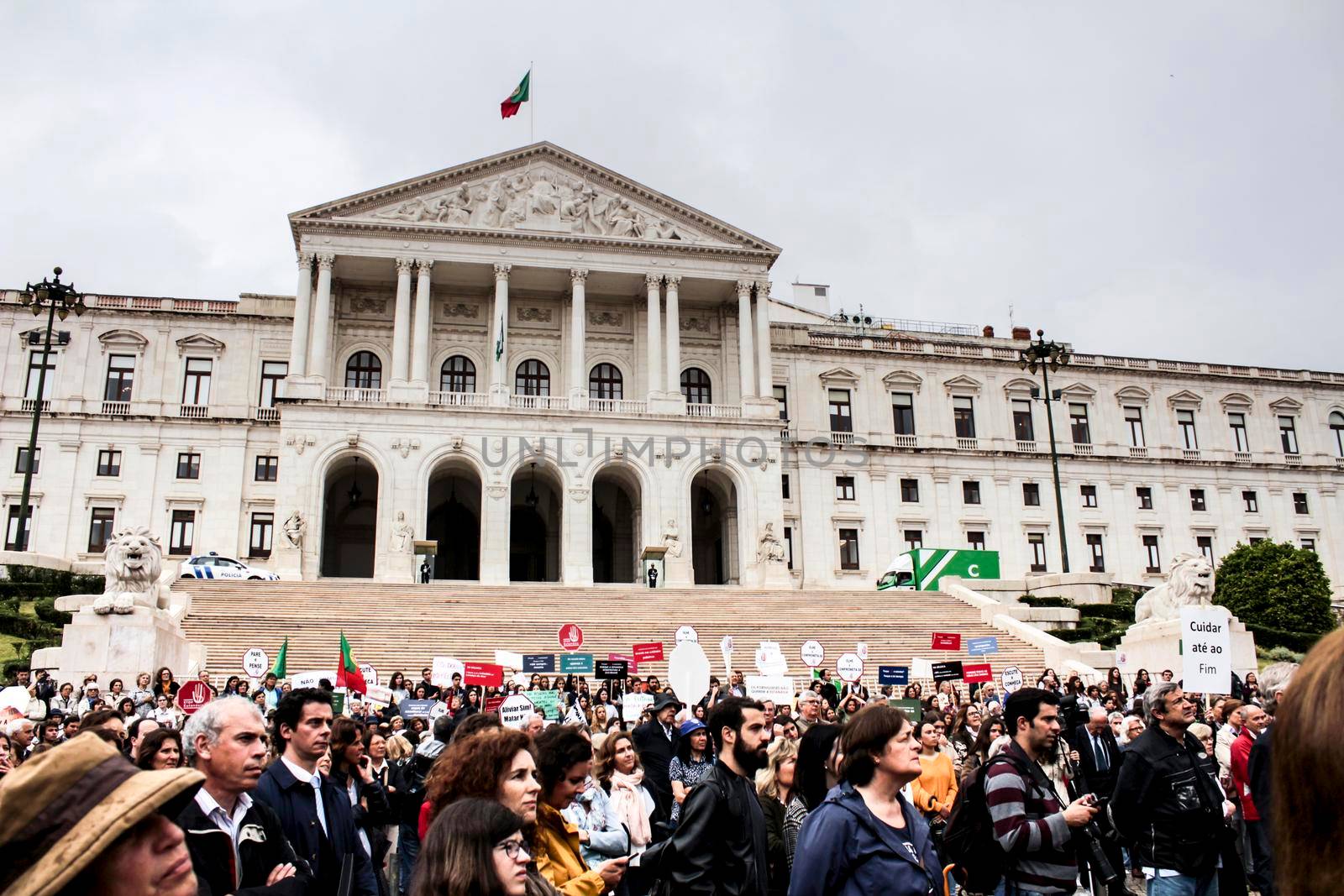 Lisbon, Portugal- May 24, 2018: Demonstrators protesting with placards against euthanasia and asking for palliative care at the doors of the Assembly of the Republic in Lisbon, Portugal