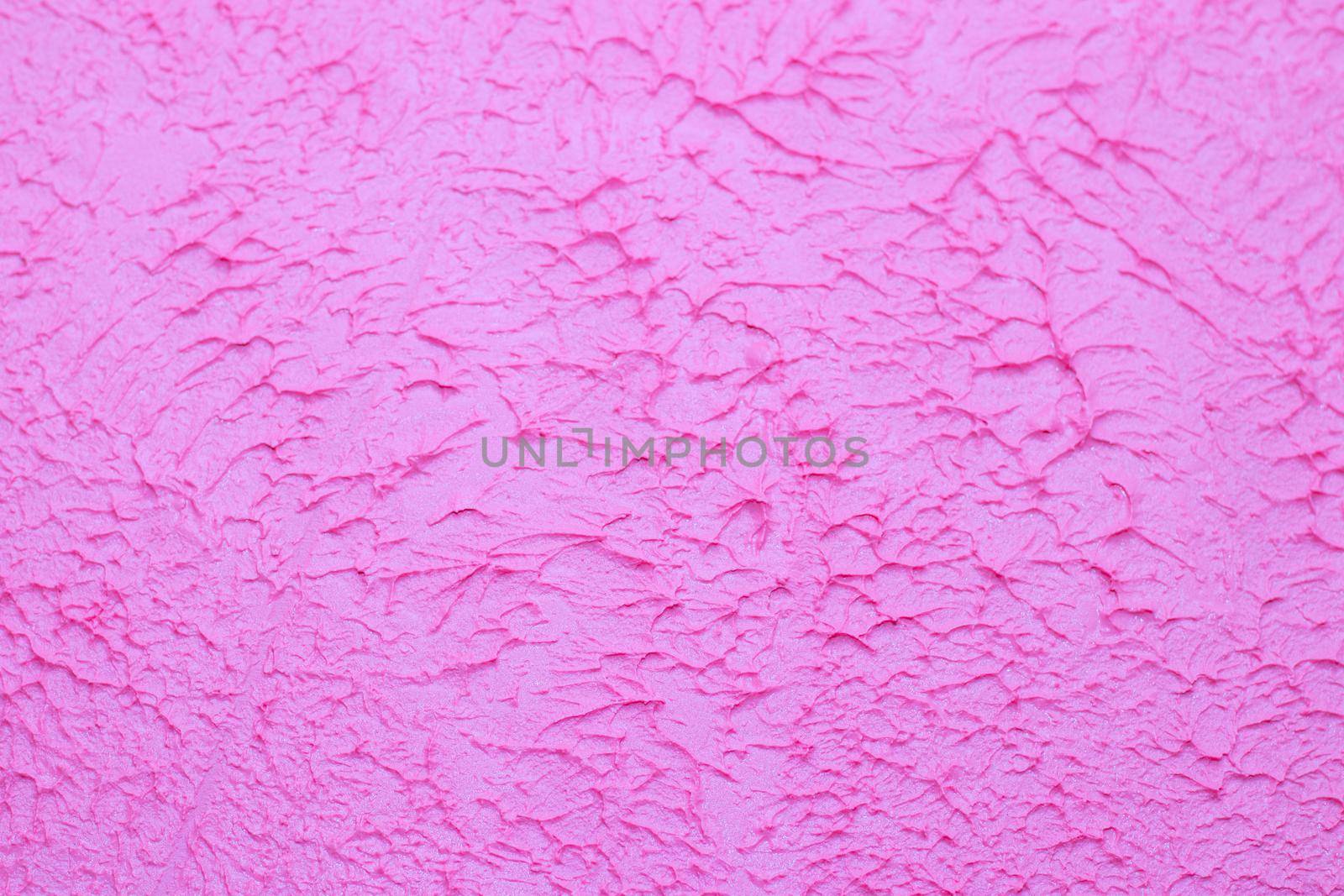 Pink background texture of putty . Decorative wall decoration. Pink wall. Texture with your own hands. Copy Space