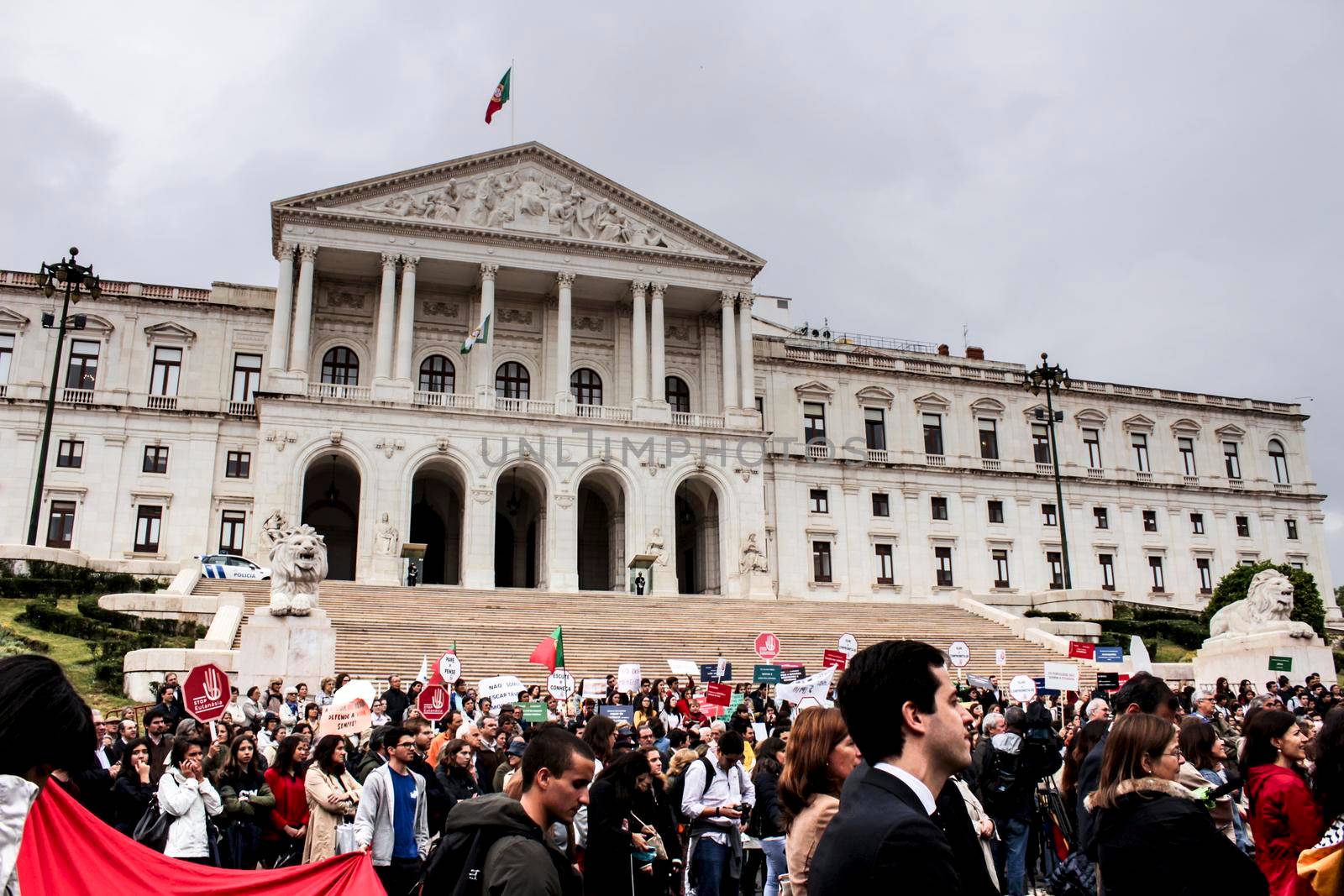 Lisbon, Portugal- May 24, 2018: Demonstrators protesting with placards against euthanasia and asking for palliative care at the doors of the Assembly of the Republic in Lisbon, Portugal