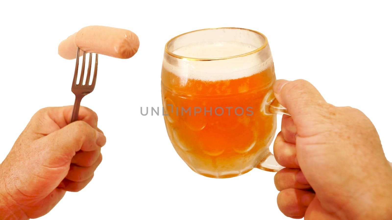 sausage on a fork and a mug of beer in male hands, isolate on a white background