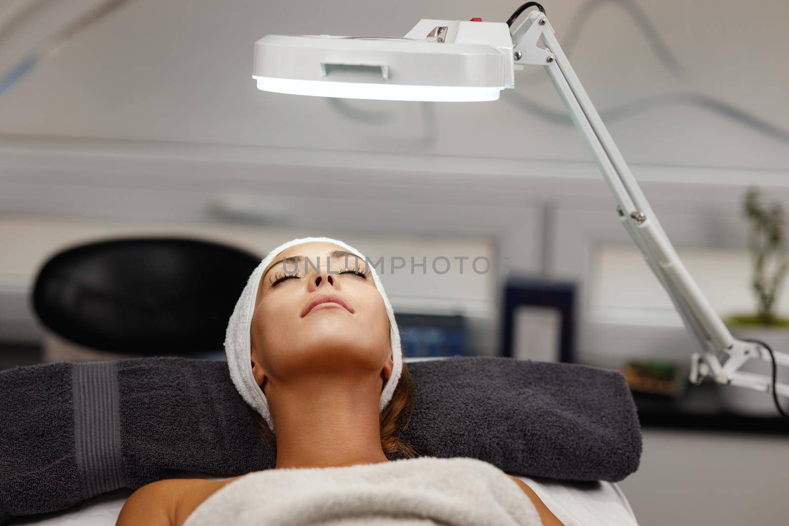 Shot of a beautiful young woman on a facial treatment at the beauty salon.