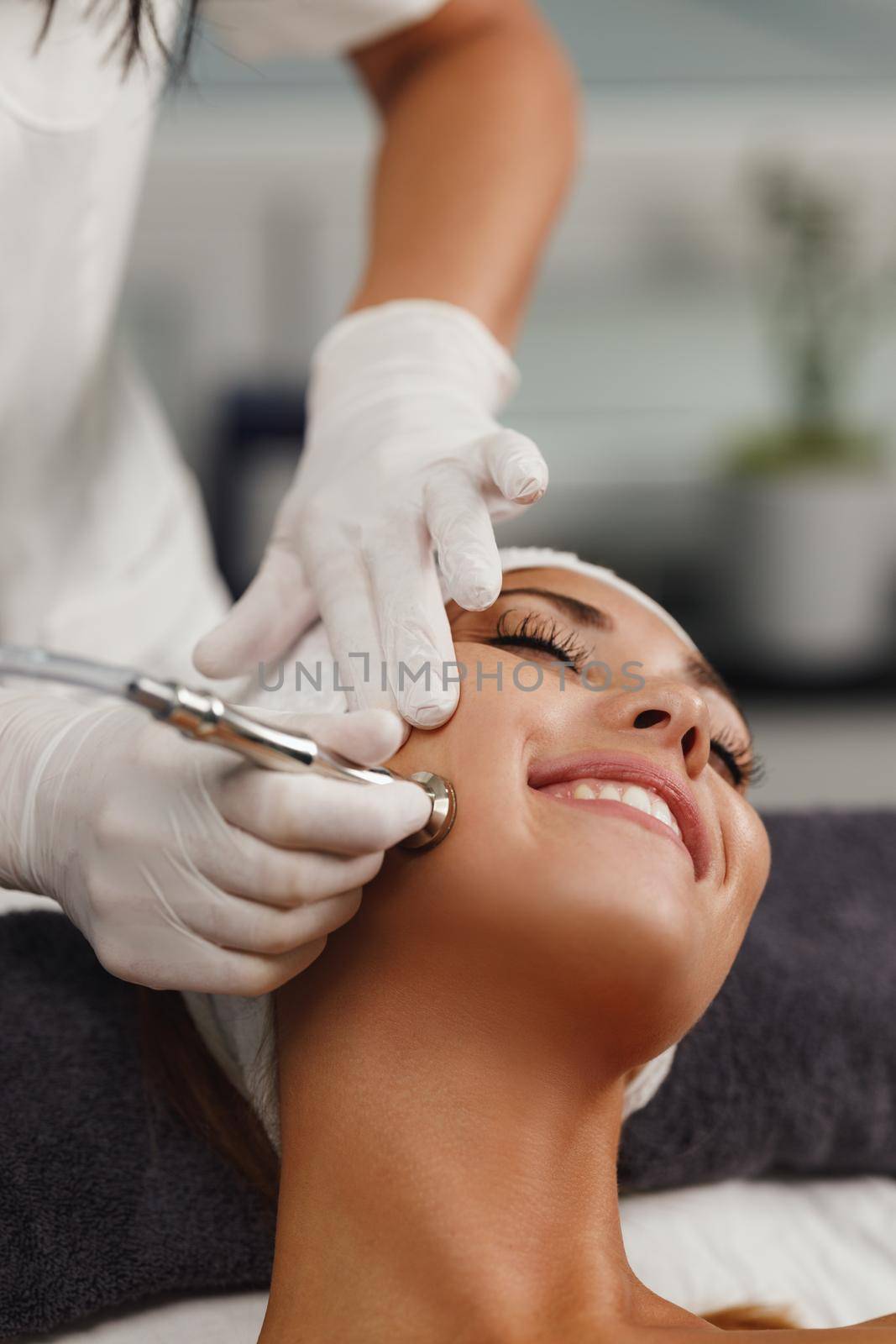 Shot of a beautiful young woman on a facial treatment at the beauty salon.