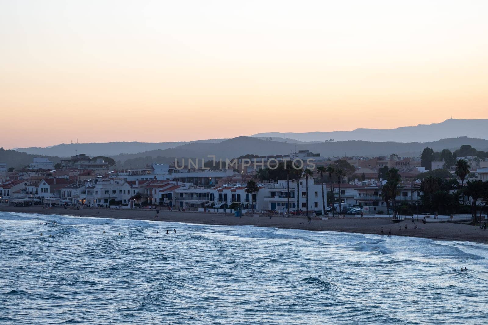 Sunset in the tourist city of AltaFulla in the province of Tarragona in Catalonia, Spain in summer by martinscphoto