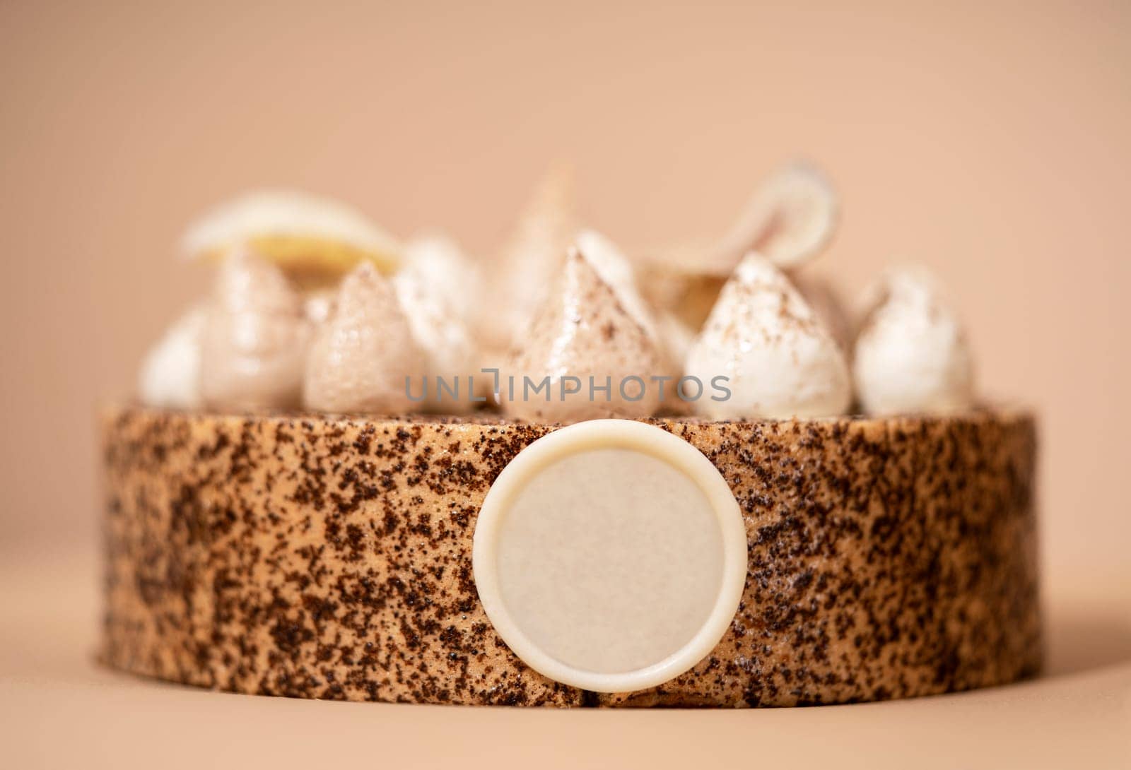 A delicious-looking dessert of a round cake on a brown plate, topped with a generous helping of fluffy white whipped cream