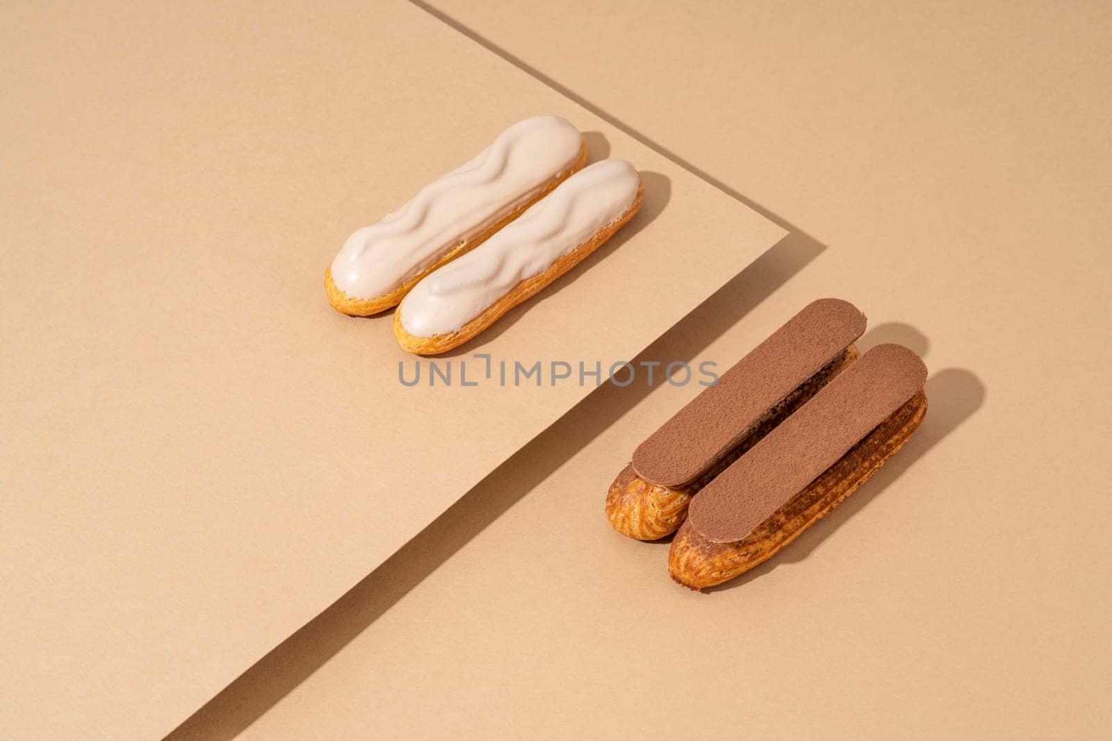 A set of delicious glazed donuts in a variety of flavors, arranged on a cardboard paper in an inviting display by A_Karim