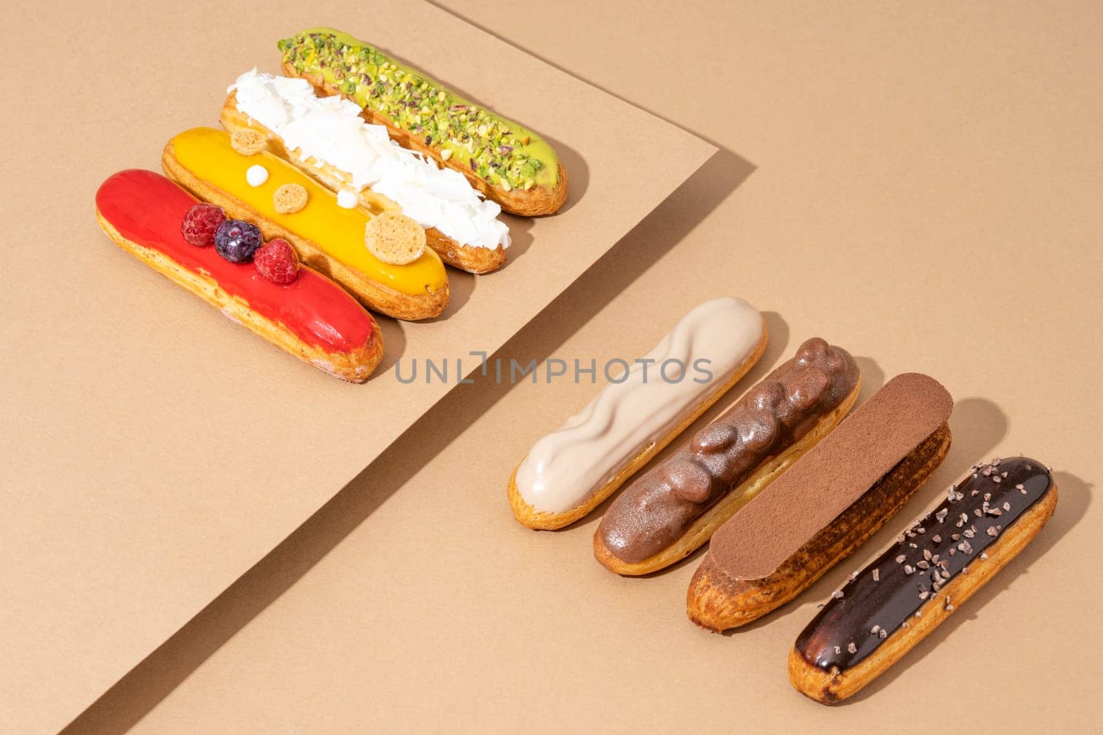 A set of delicious glazed donuts in a variety of flavors, arranged on a cardboard paper in an inviting display by A_Karim