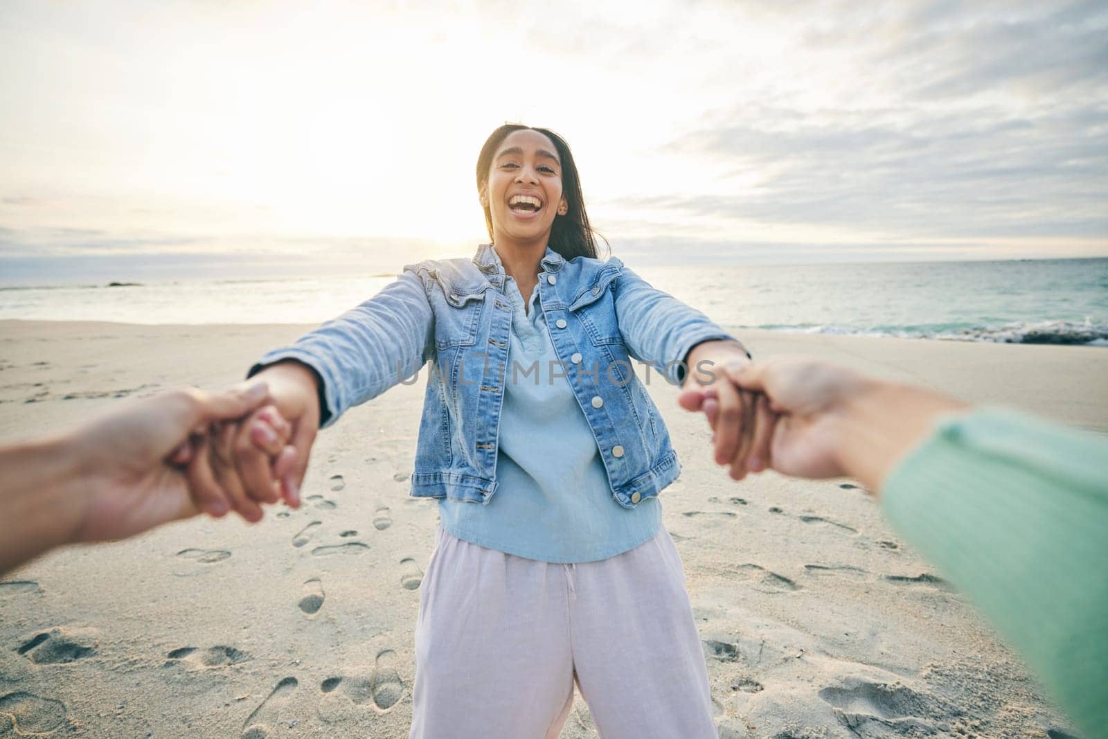 Love, funny and a couple on the beach together for fun at sunset during summer vacation or holiday. Nature, trust and romance with a woman laughing on the sand while on a date with her girlfriend by YuriArcurs